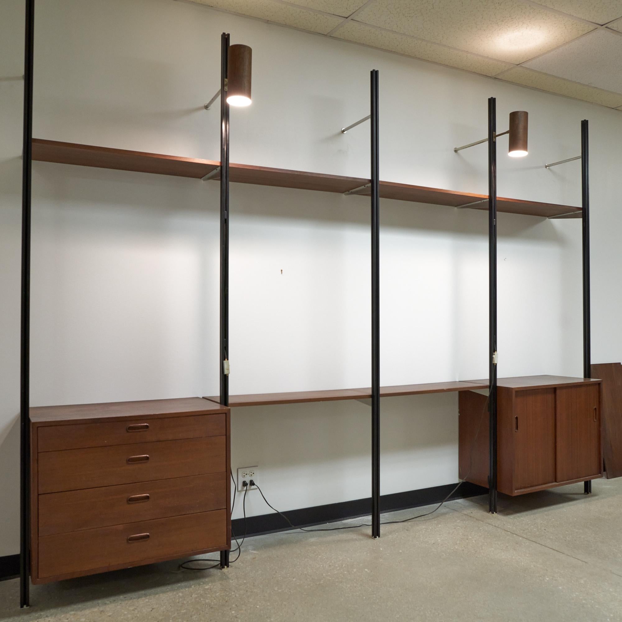 George Nelson for Herman Miller mid-century walnut omni wall unit - 4 bay

This wall unit measures: 129.5 wide x 18 deep x 95 inches high.

All pieces of furniture can be had in what we call restored vintage condition. That means the piece is