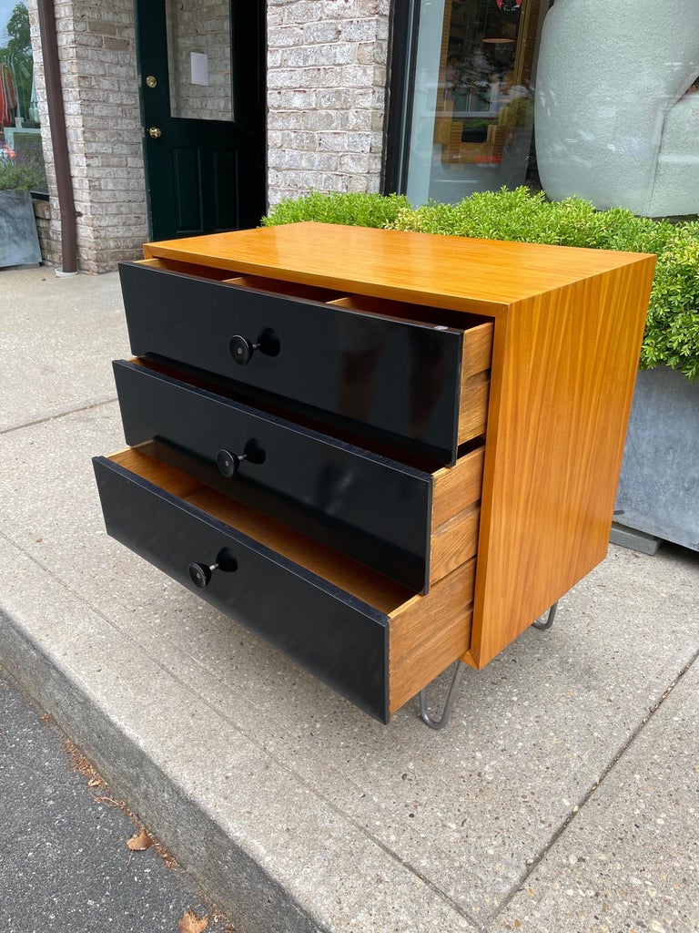 George Nelson cabinet by Herman Miller, walnut wood case with three drawers with black finish, original zinc hairpin legs, signed with foil label, 34
