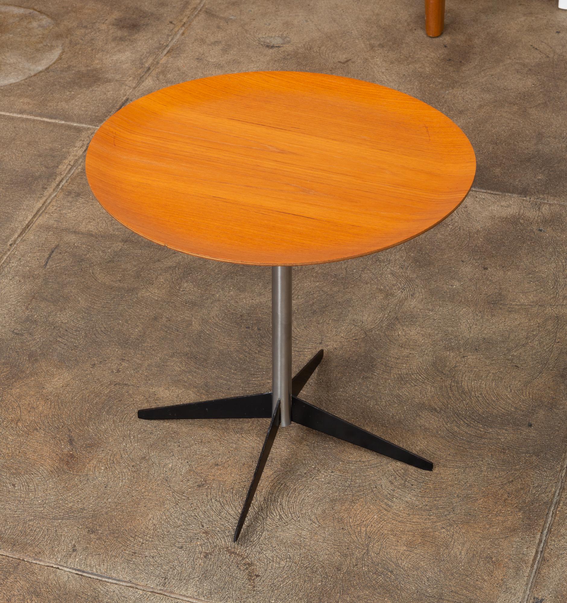 Rare George Nelson for Herman Miller drinks table. This Minimalist side table features a round walnut plywood top, nickel plated steel tube base, with four enameled steel fin legs.

Condition: Excellent vintage condition; professionally cleaned