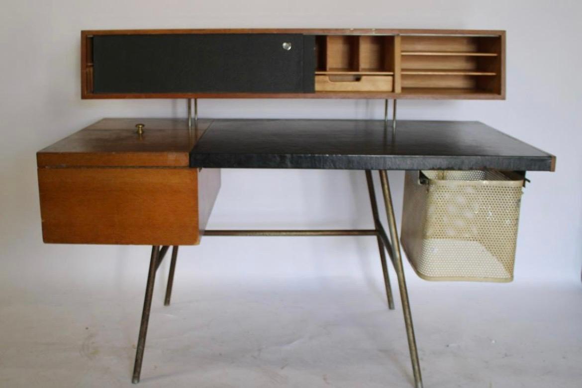 George Nelson for Herman Miller, desk n. 4658, walnut, steel, leather, United States, 1946

Made of walnut with original black leather writing surface and sliding doors, resting on a base in steel, the desk 4658 does not only convinces through his