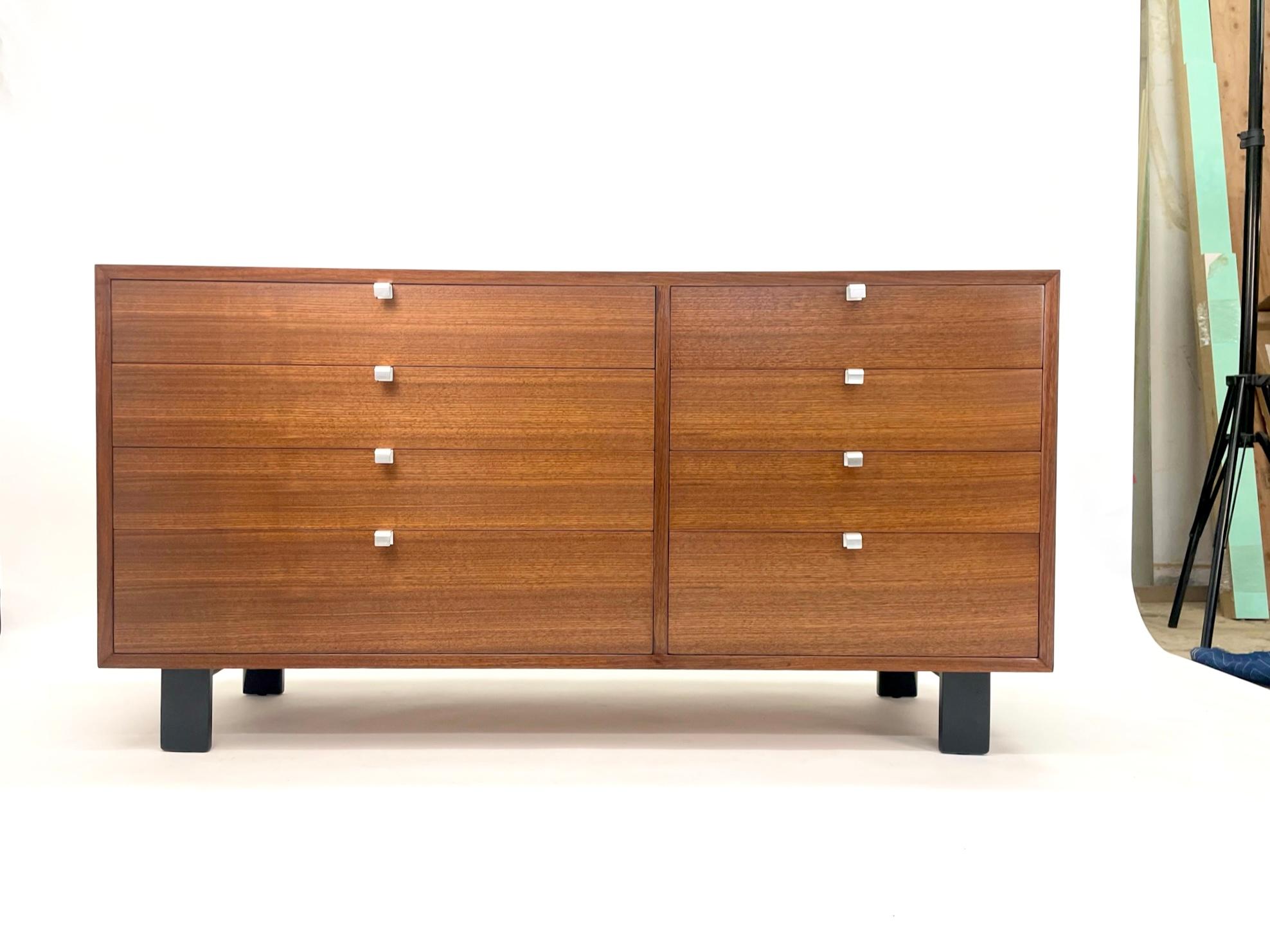 We have 2 iconic and classic Mid-Century Modern dressers designed by George Nelson for the Herman Miller Basic Series, circa 1950s. Featuring a gorgeous walnut wood dresser with eight spacious drawers all adorned with original striking brushed