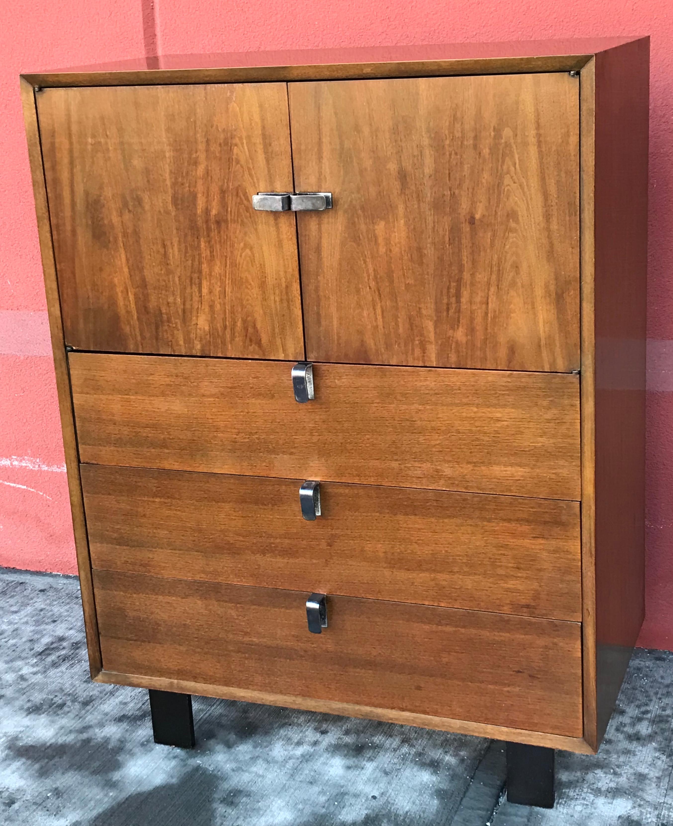 Early production of George Nelson walnut highboy dresser for Herman Miller, very rare silver plated drawer pulls. All original finish with beautiful patina.