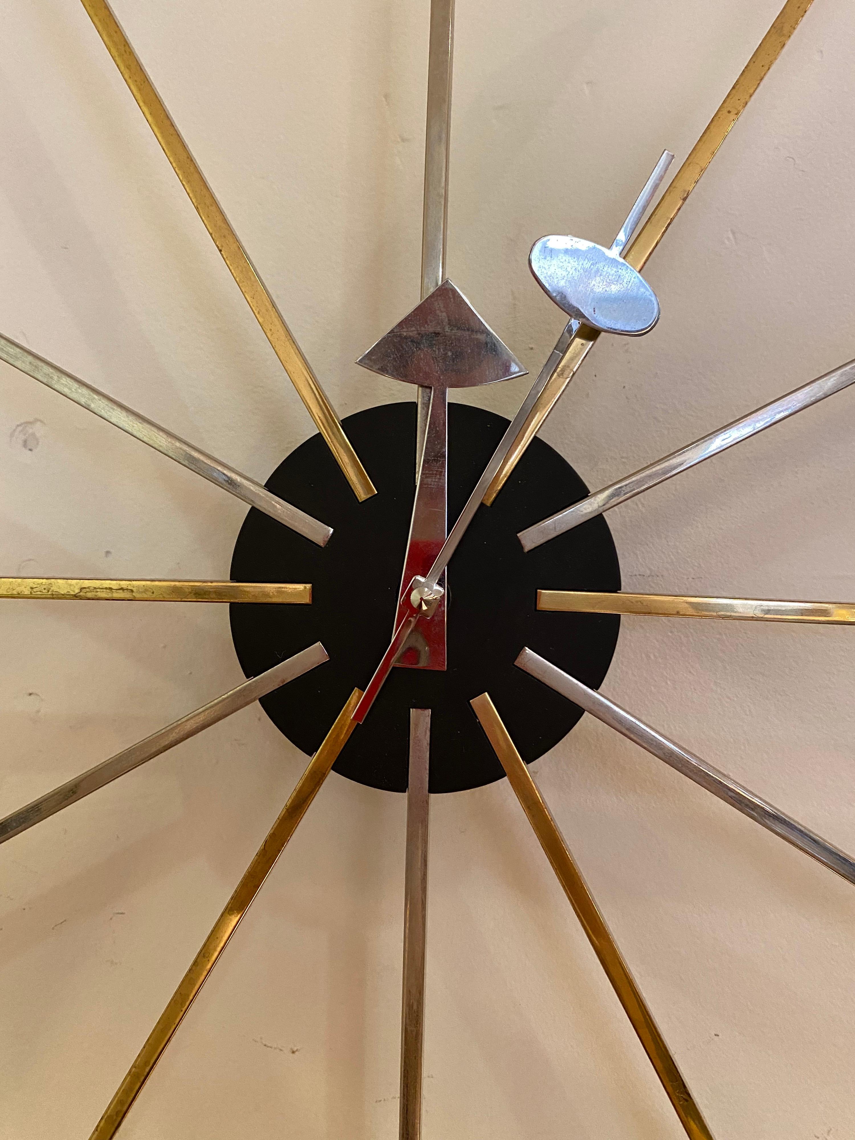 George Nelson for vitra star clock with arms of chrome and brass. This is probably a 10 year old model, newly replaced vitra clock motor.