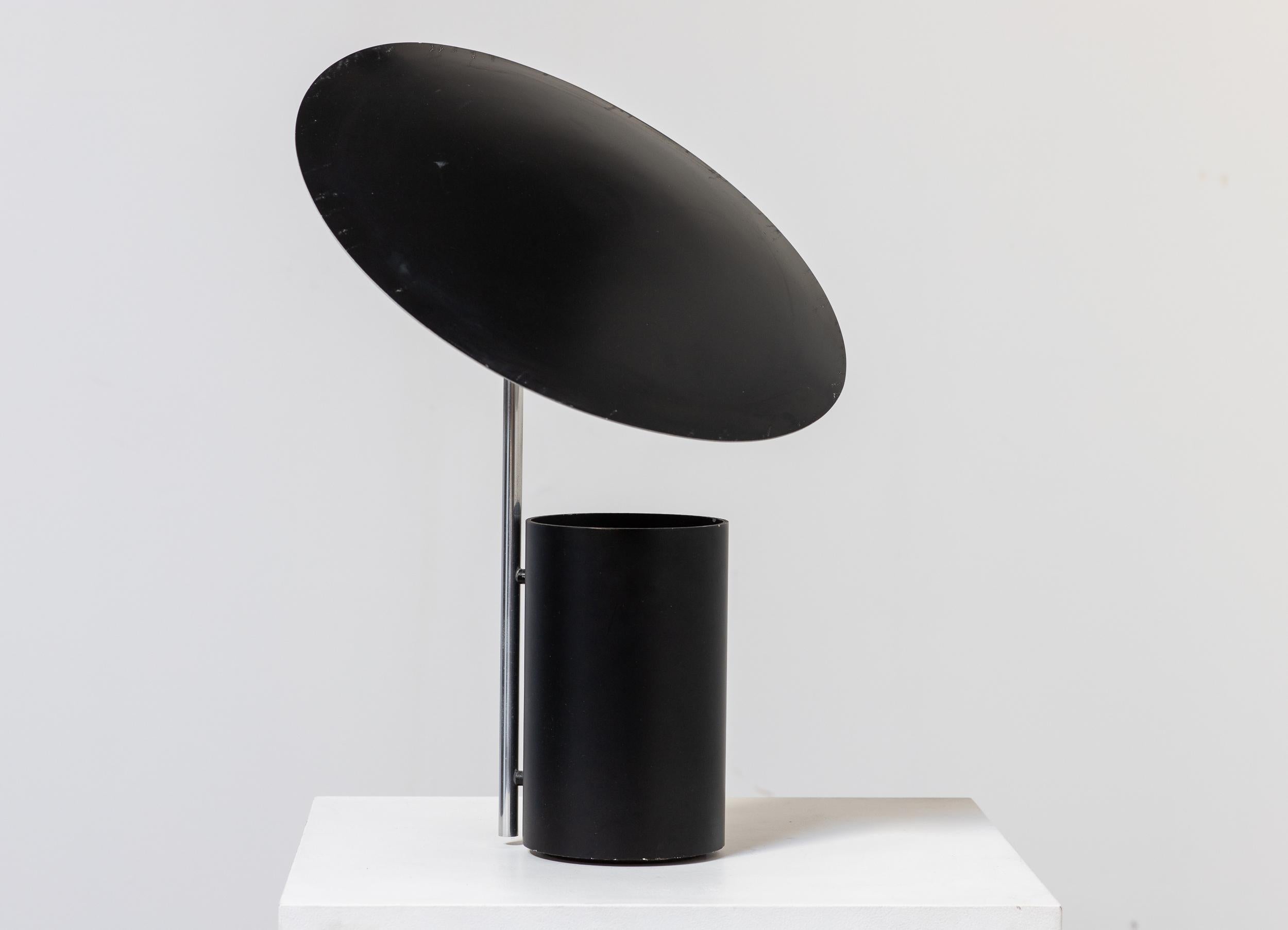 Half Nelson table lamp, designed by George Nelson for Koch and Lowy. This thoughtful design features a pivoting metal shade that can be adjusted to seemingly limitless positions, both vertical and horizontal. The two-way light source is cleverly