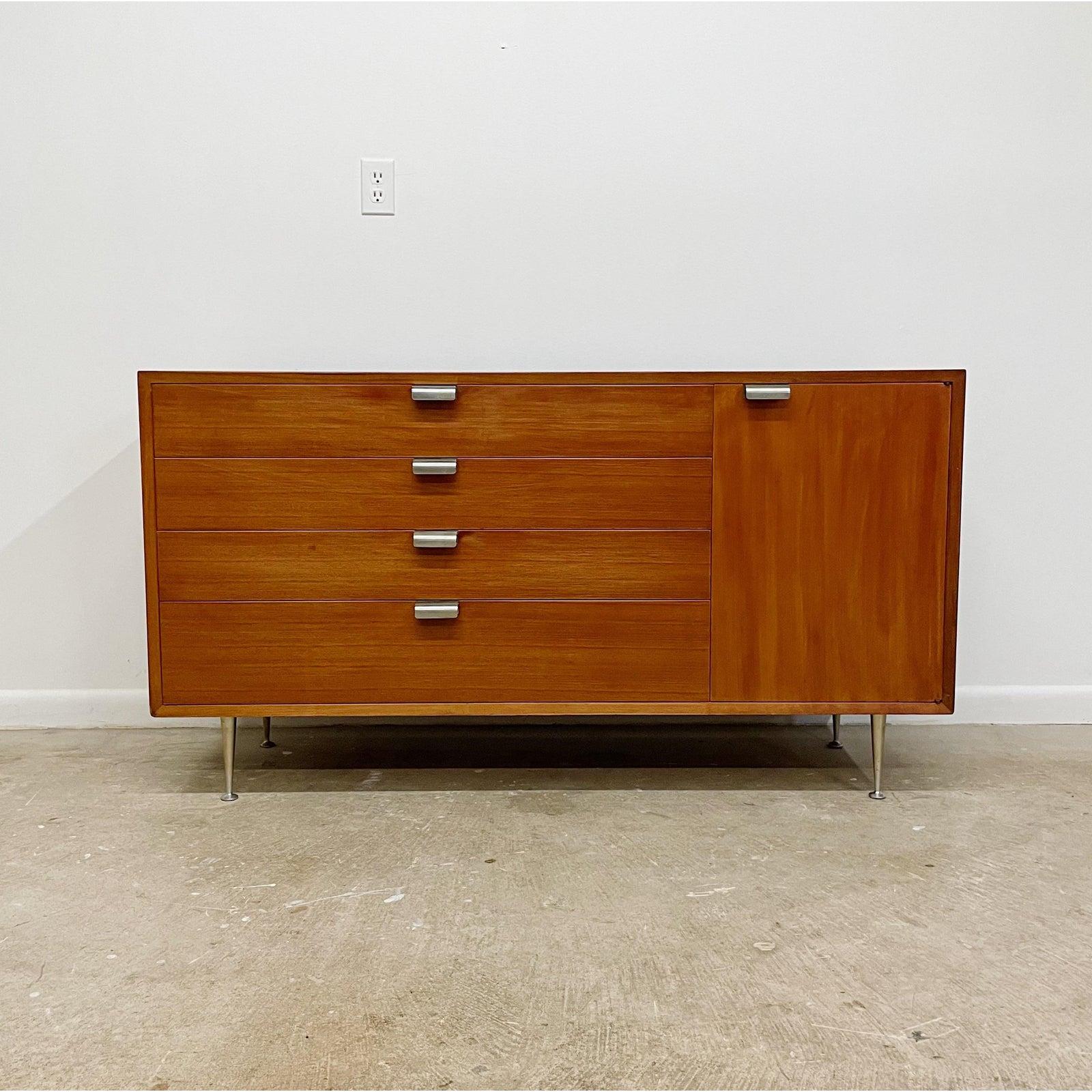 Classic, clean lines George Nelson for Herman Miller dresser or credenza with four deep dovetail drawers, and one side door with interior adjustable wood shelf. The hardware is brushed steel and the original custom ordered thin edge legs are brushed