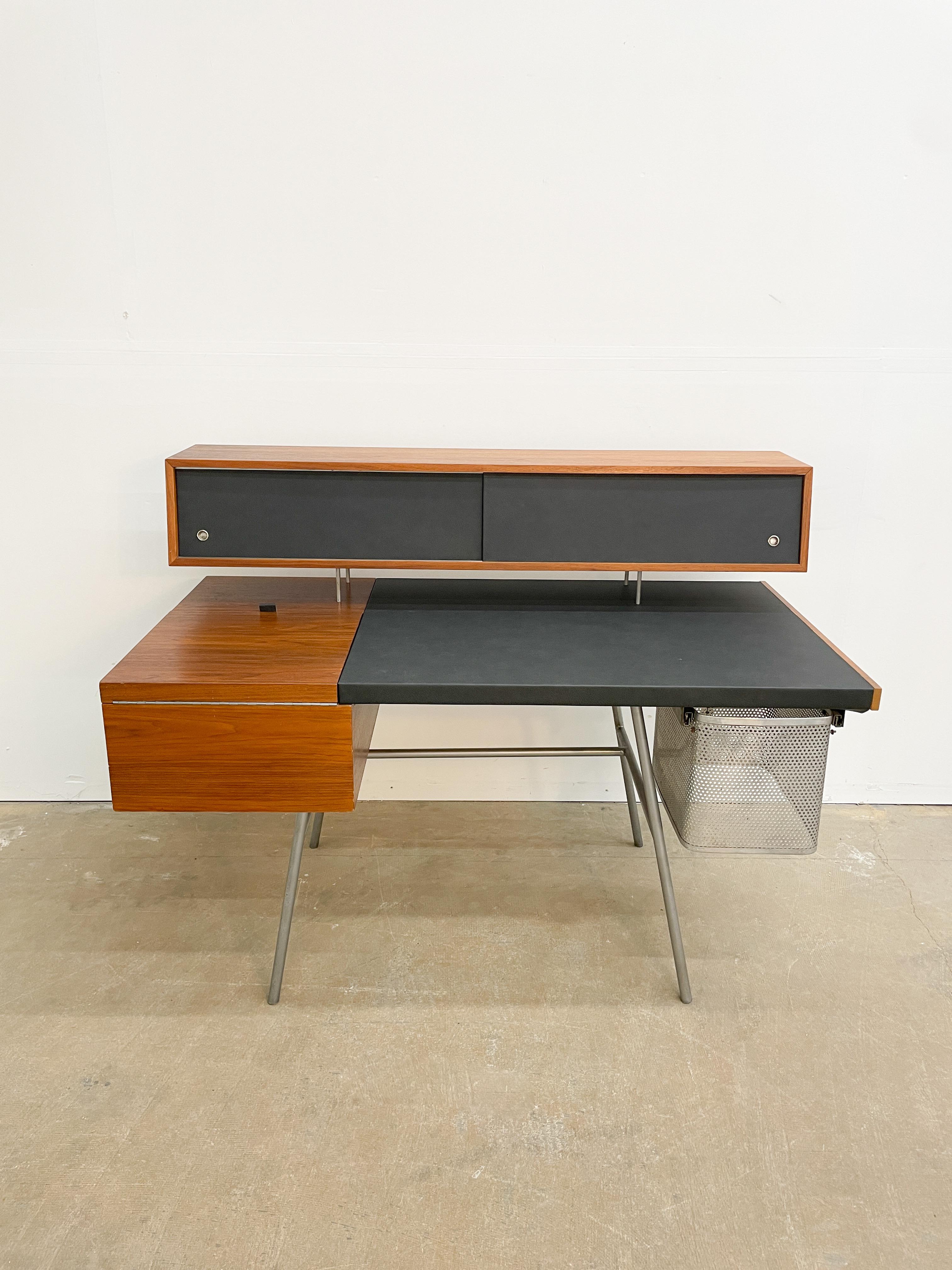 George Nelson’s dynamic modern take on the home desk was designed in 1946 and produced by Herman Miller for the first collection under Nelson’s helm. Featuring walnut case work, a satin finish steel frame and leather top this piece has the perfect