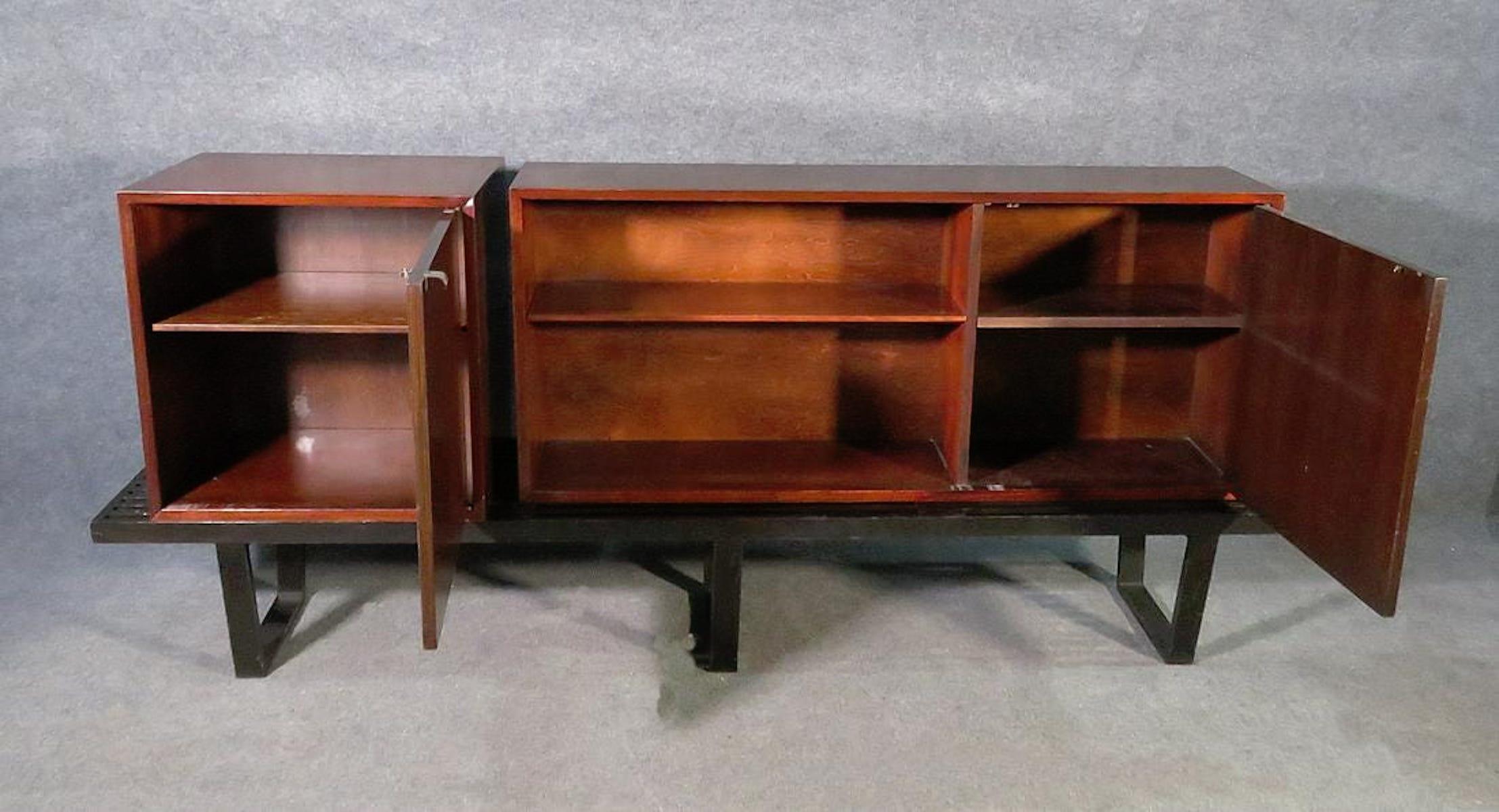 Mid-Century Modern cabinet set on slat bench by George Nelson for Herman Miller.
(Please confirm item location - NY or NJ - with dealer).
 