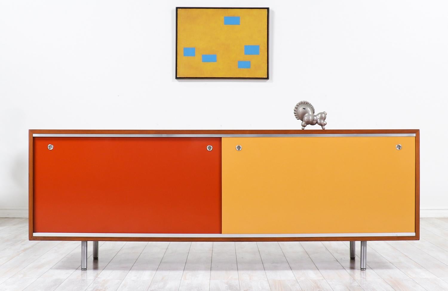 One of the most iconic modern credenzas by the famous American designer, Goerge Nelson, in collaboration with Herman Miller during the 1950s. Known as the Model-EOG for Executive Office Group, our skillfully crafted credenza features a sturdy walnut