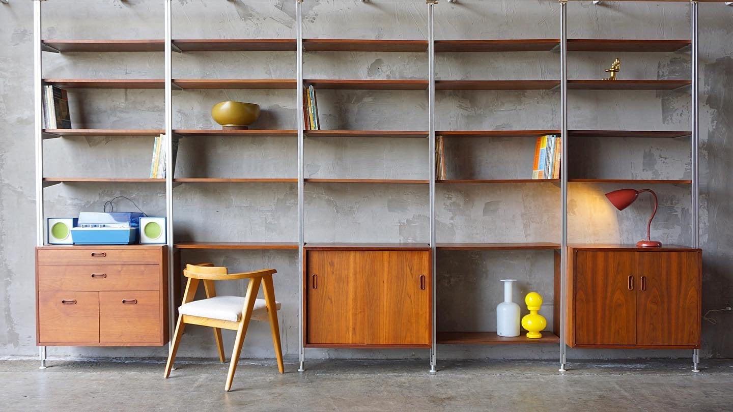 Large and complete set of George Nelson ‘Omni’ shelving. 

This set includes;

6 aluminum freestanding tension mounted uprights. 
24 standard shelves. 
1 cabinet box with sliding doors. 
1 cabinet with box with one interior shelf. 
1 box