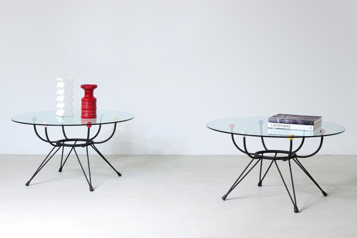 COD-1439
George Nelson

Pair of low tables with curved iron structure and glass top resting on small colored spheres.

UK manufacture, 1950s.