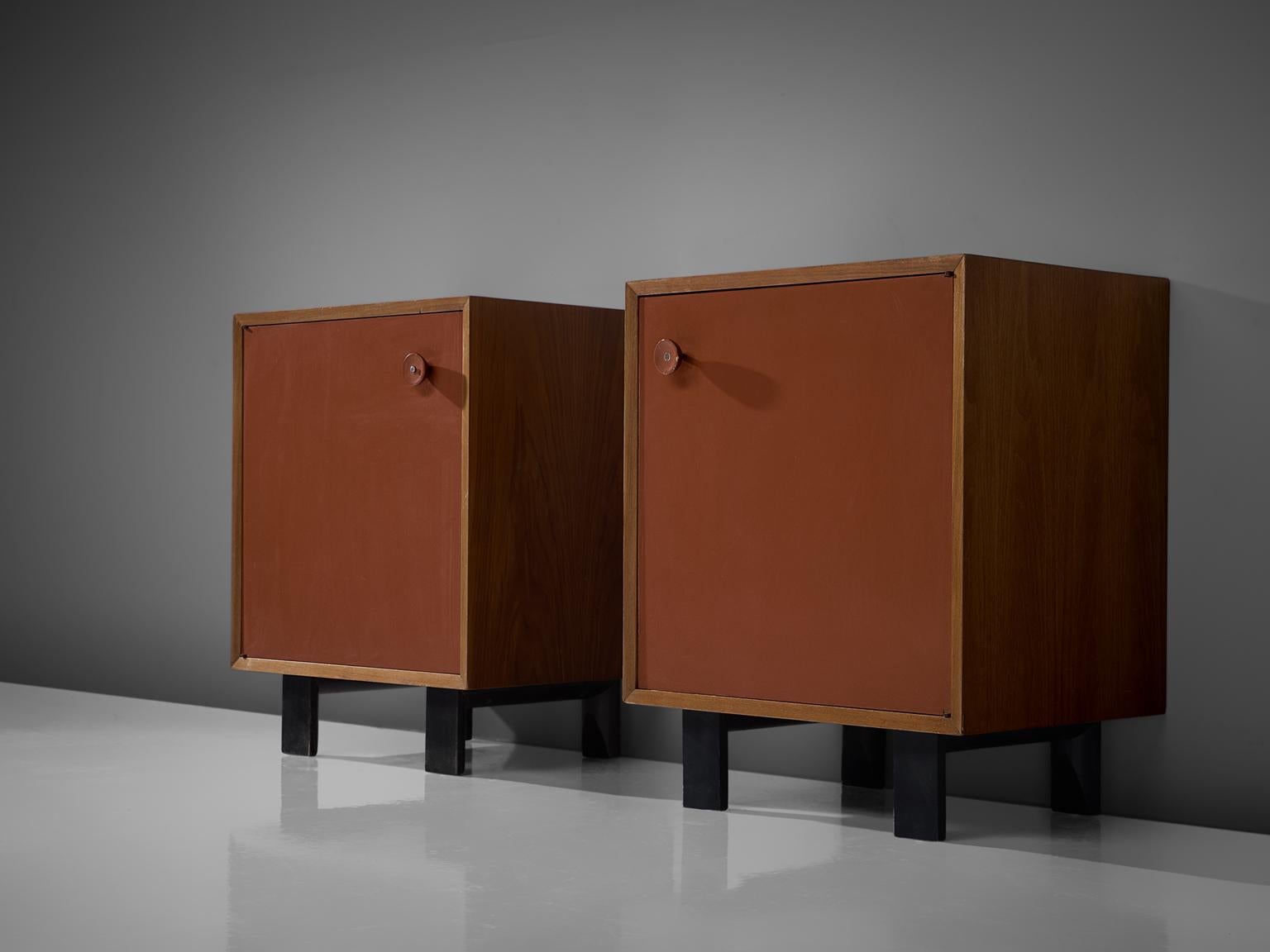 George Nelson for Herman Miller Zeeland Michigan, set of two cabinets in teak and patinated black wood, United States, 1950s. 

This set of cabinets present patinated red color doors, which blend nicely with the light color of the teak. On the
