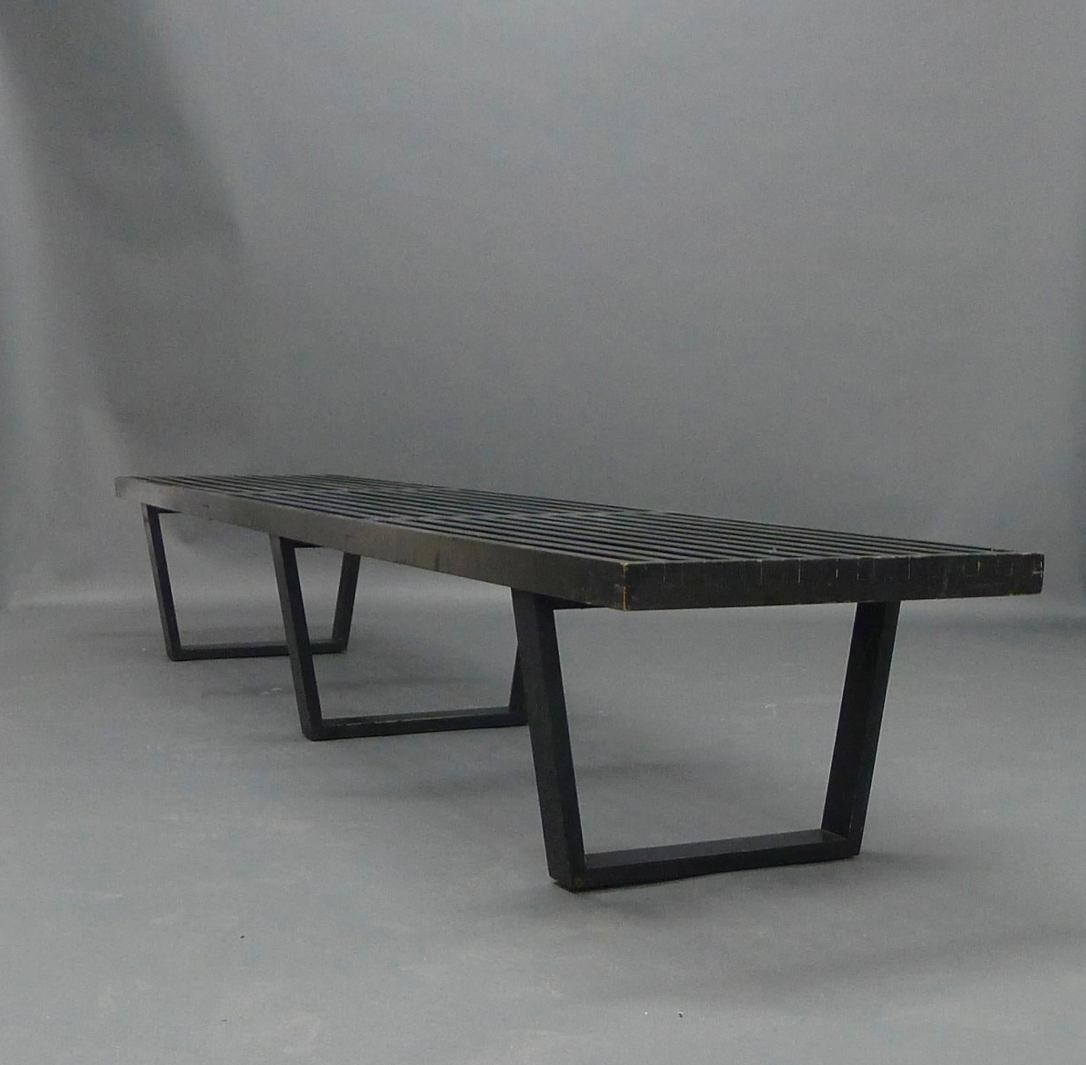 George Nelson, Platform Bench, for Herman Miller, late 1940s

Black painted birch frame, the slatted top on three curved supports,
235cm wide, 47cm deep, 36cm high

This is an original authentic piece, and a rarer long version with three legs rather