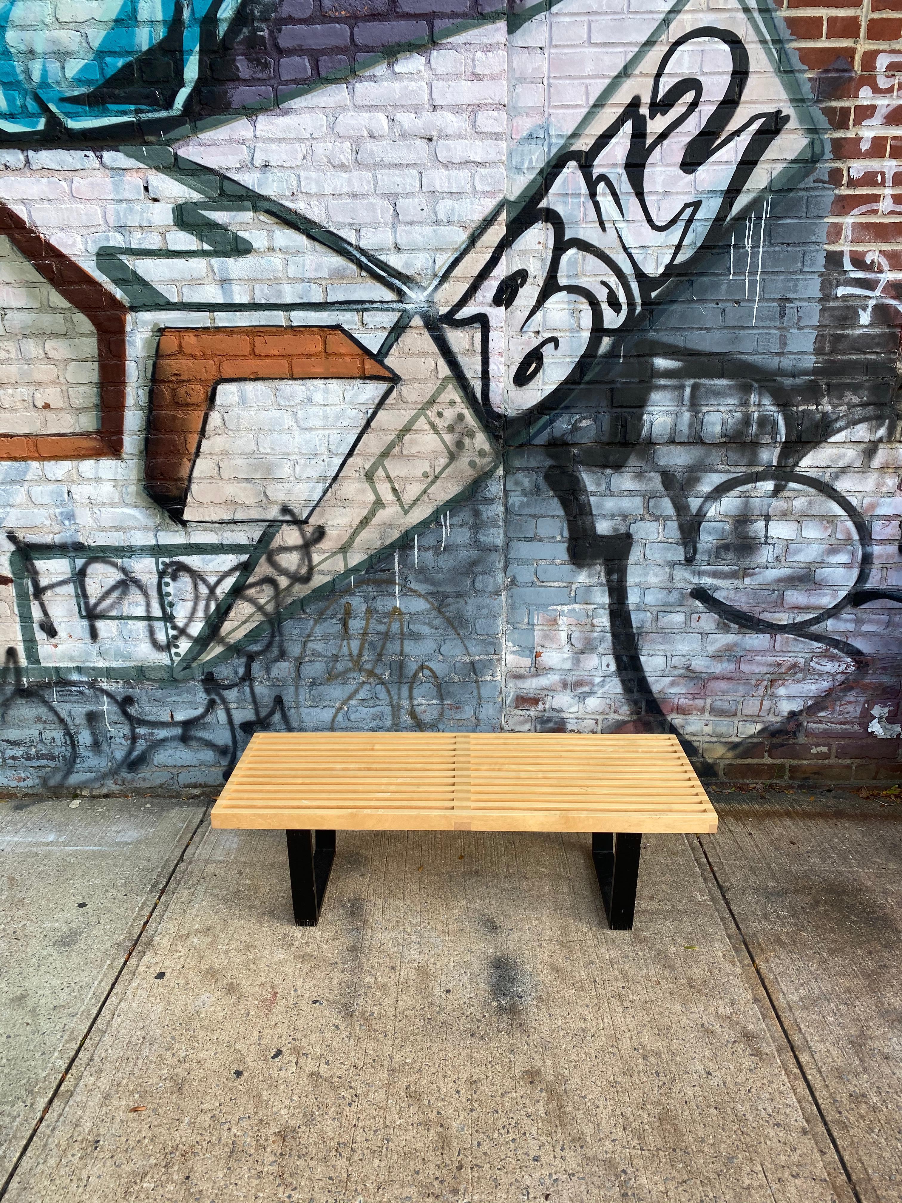 Classic example of the iconic George Nelson slat bench. Can be used as a coffee table. Solid and sturdy. Even appearance and patina. Presents well. Signed with original Herman Miller maker label.