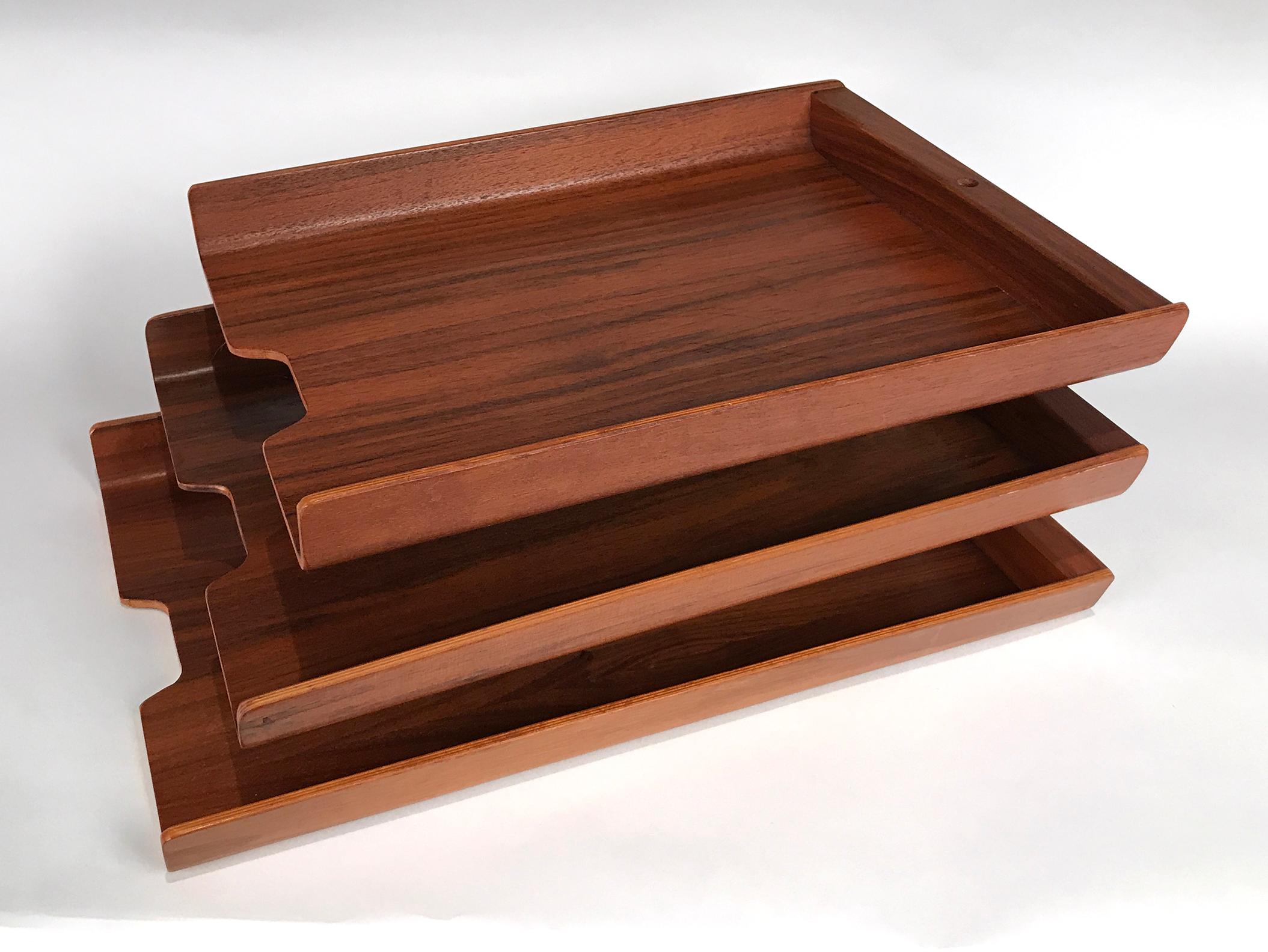 Extremely rare letter tray designed by George Nelson & Associates for Howard Miller Clock Company, circa 1950. Consists of three teak plywood trays that swivel on an aluminum pin.