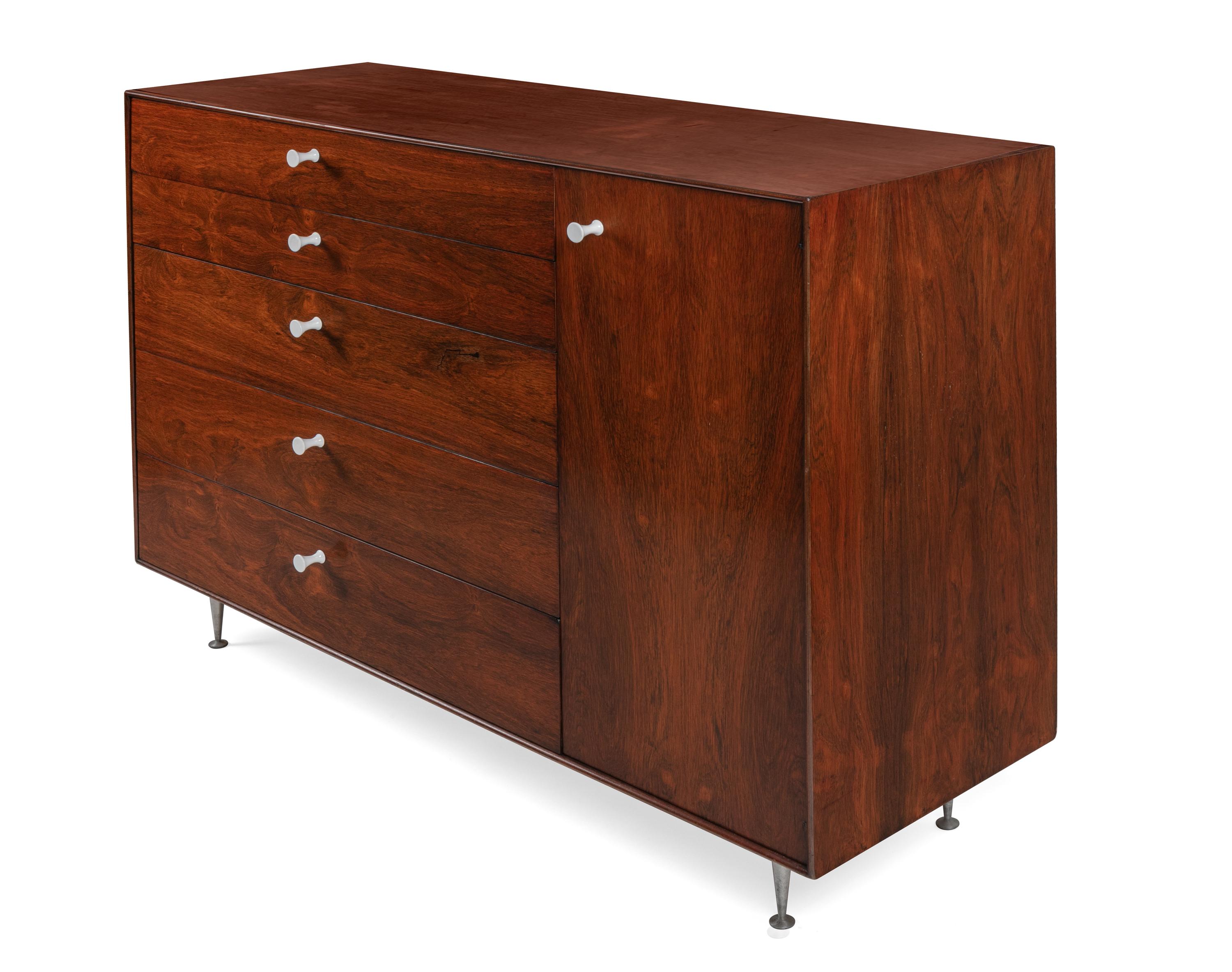 An outstanding piece of the highly desirable Thin edge line of furniture. The quality of the rosewood is magnificent and the storage possibilities are excellent.