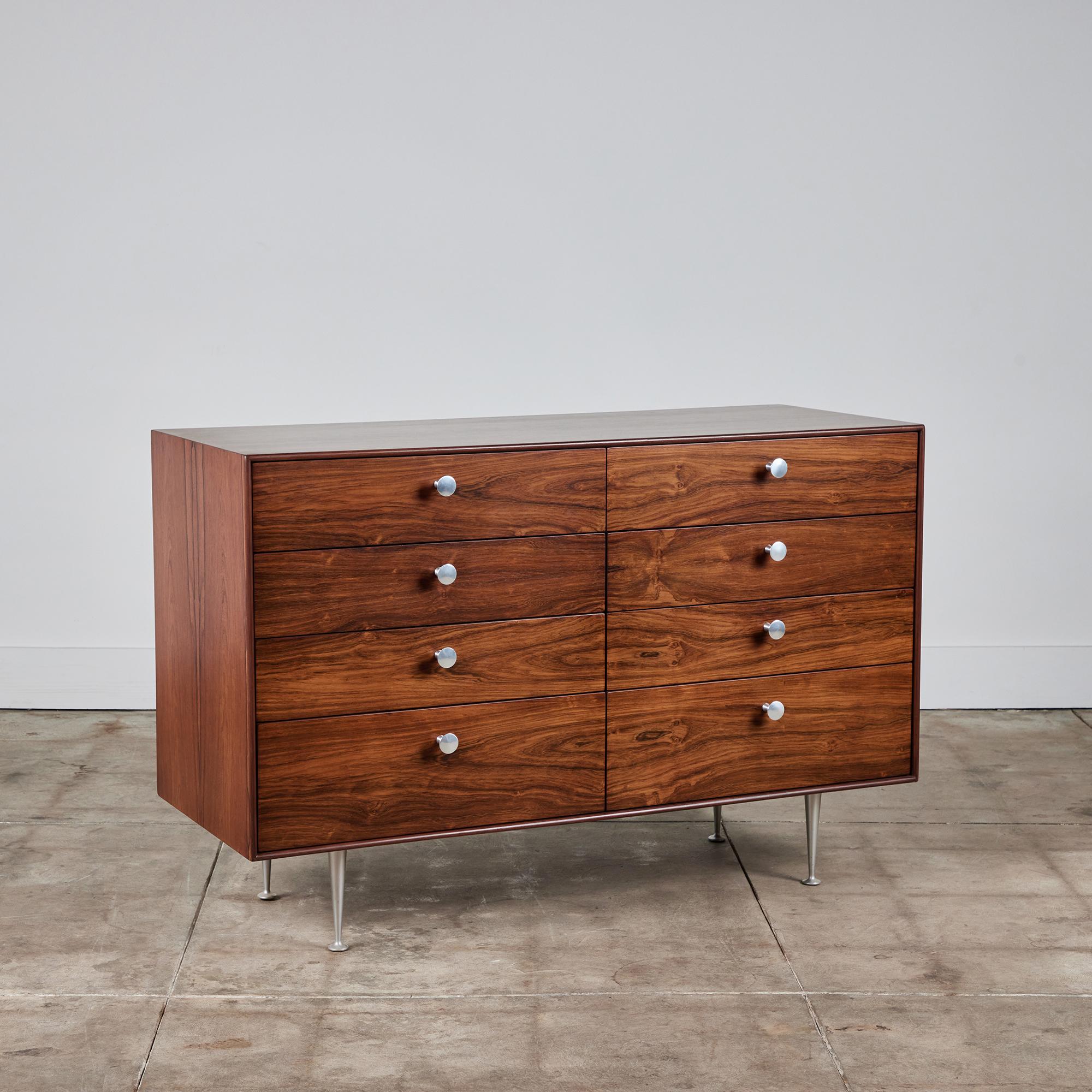 An eight-drawer double dresser from George Nelson’s Thin Edge collection for Herman Miller. Design features the slender rosewood case for which the series was named and a double stack of drawers, each with three wide drawers and one top divided