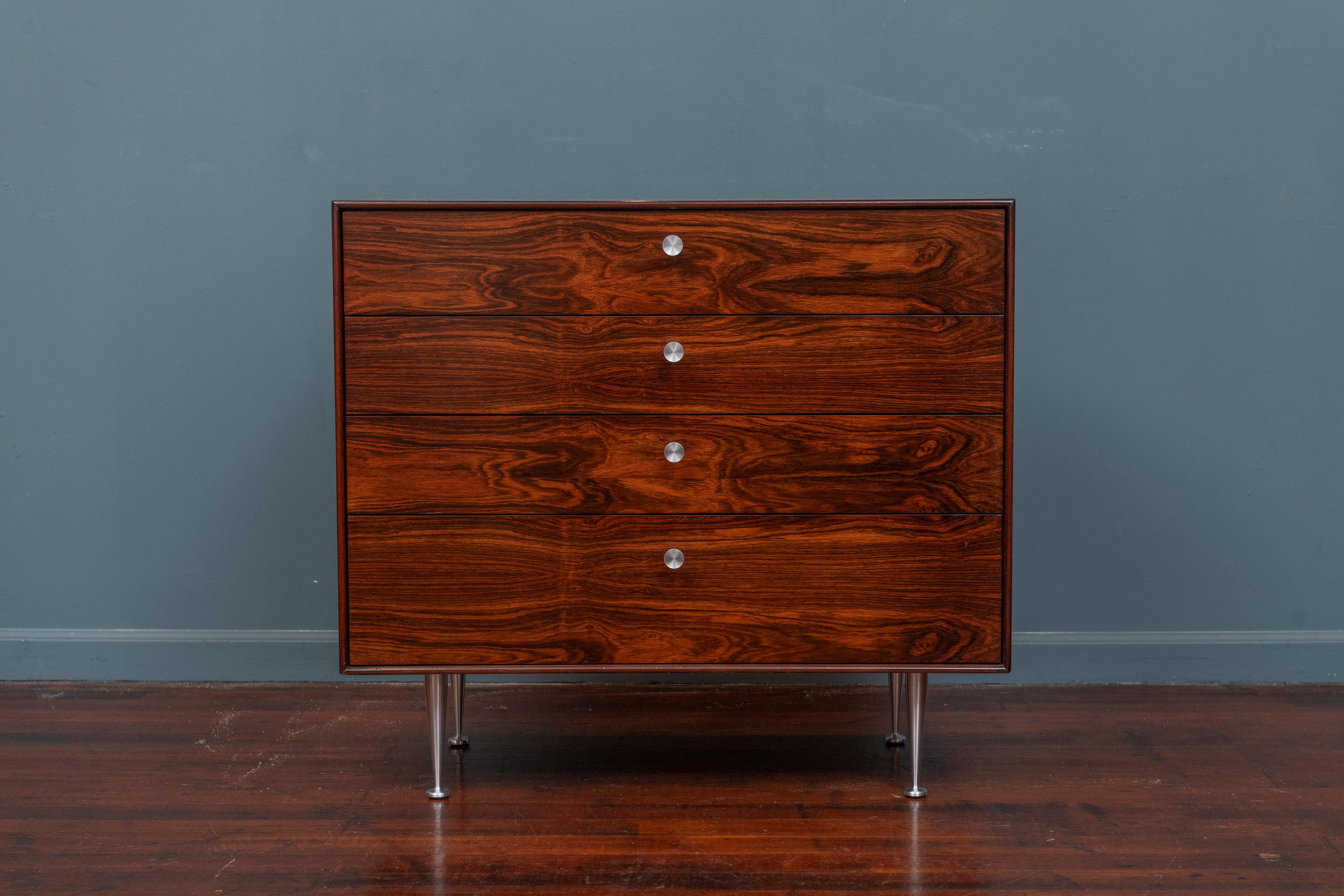 George Nelson rosewood Thin Edge chest or dresser for Herman Miller, U.S.A. Exceptional rosewood grain patterns throughout just newly refinished. Aluminum spinning top drawer pulls and polished tapering legs, labeled.