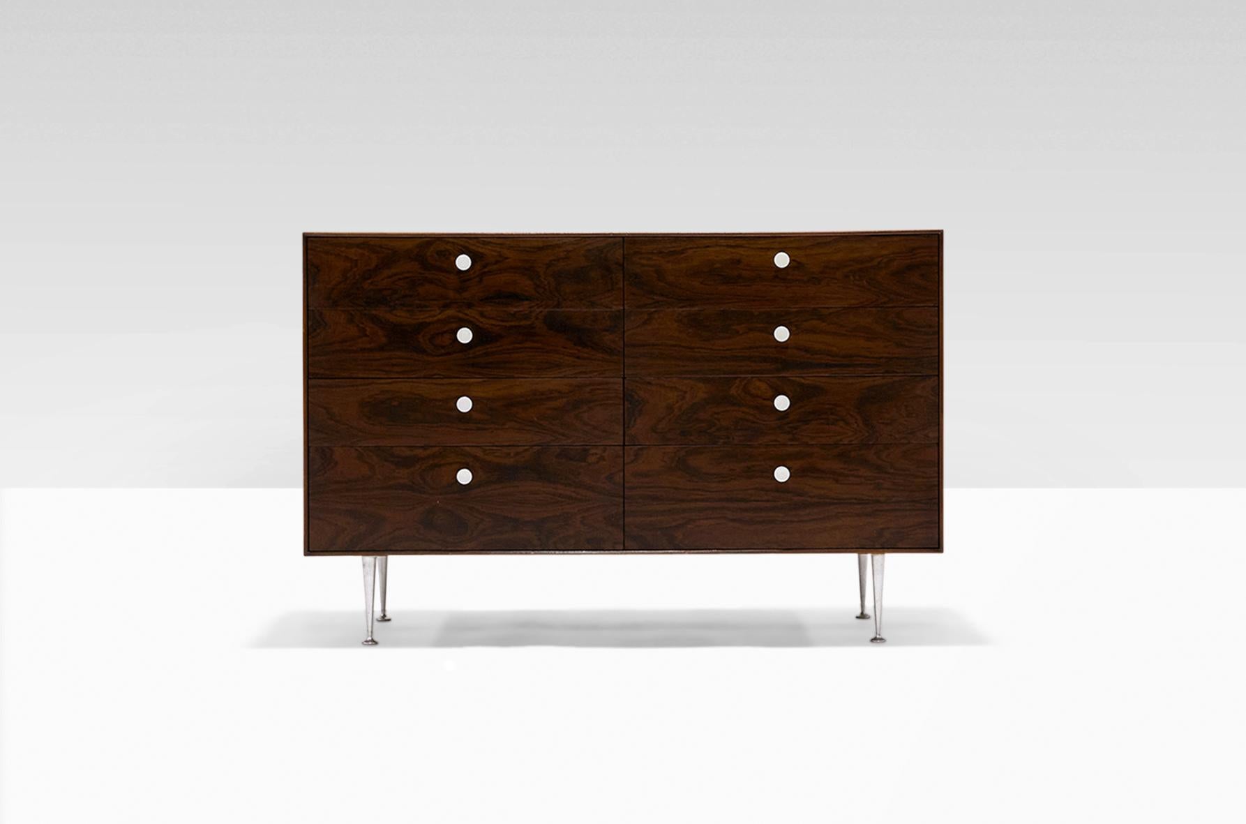 George Nelson Thin Edge eight-drawer double dresser for Herman Miller, circa 1950s. Model #5221. A classic design, this example is executed in high-quality Brazilian Rosewood with aluminum legs and white porcelain drawer pulls. Very good original
