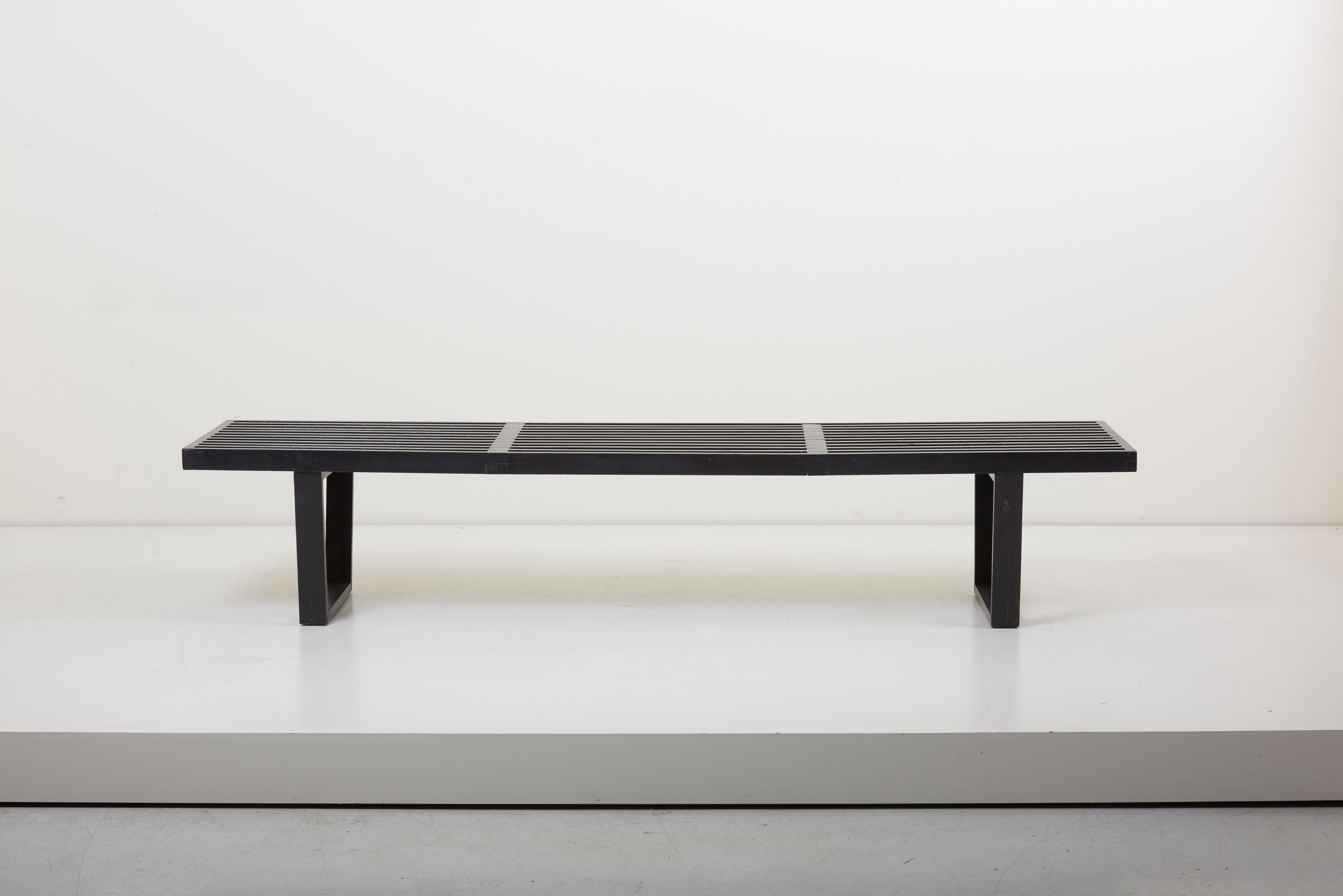 Clean lined modern bench, designed by George Nelson for Herman Miller. This slat bench is constructed from black lacquered wood.


   
    