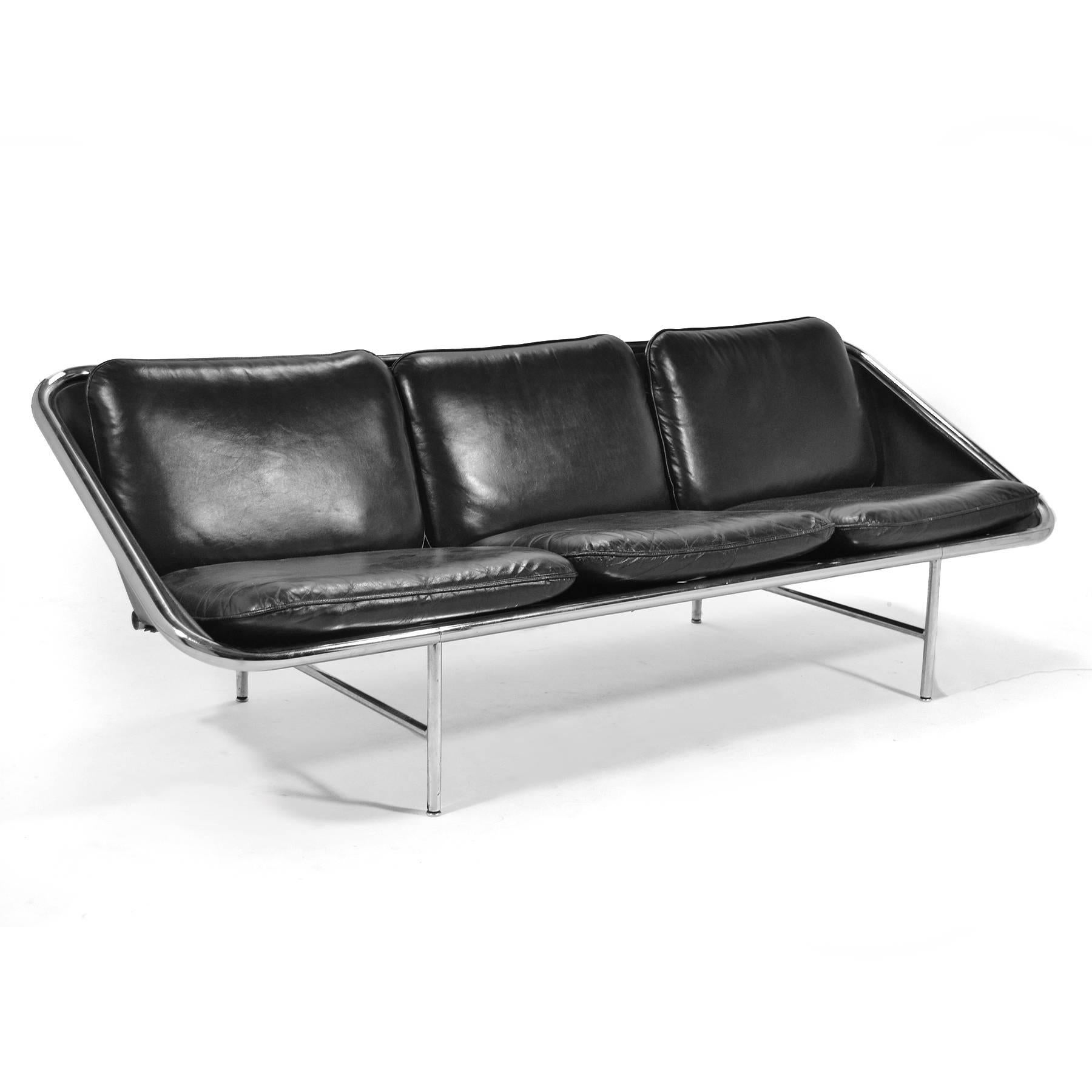 Designed in 1963 by John Svezia, Ronal Beckman and Irving Harper for George Nelson and Assoc. the sling sofa is an innovative design which uses a chrome-plated tubular steel frame, thick leather, neoprene and reinforced rubber to suspend the seat