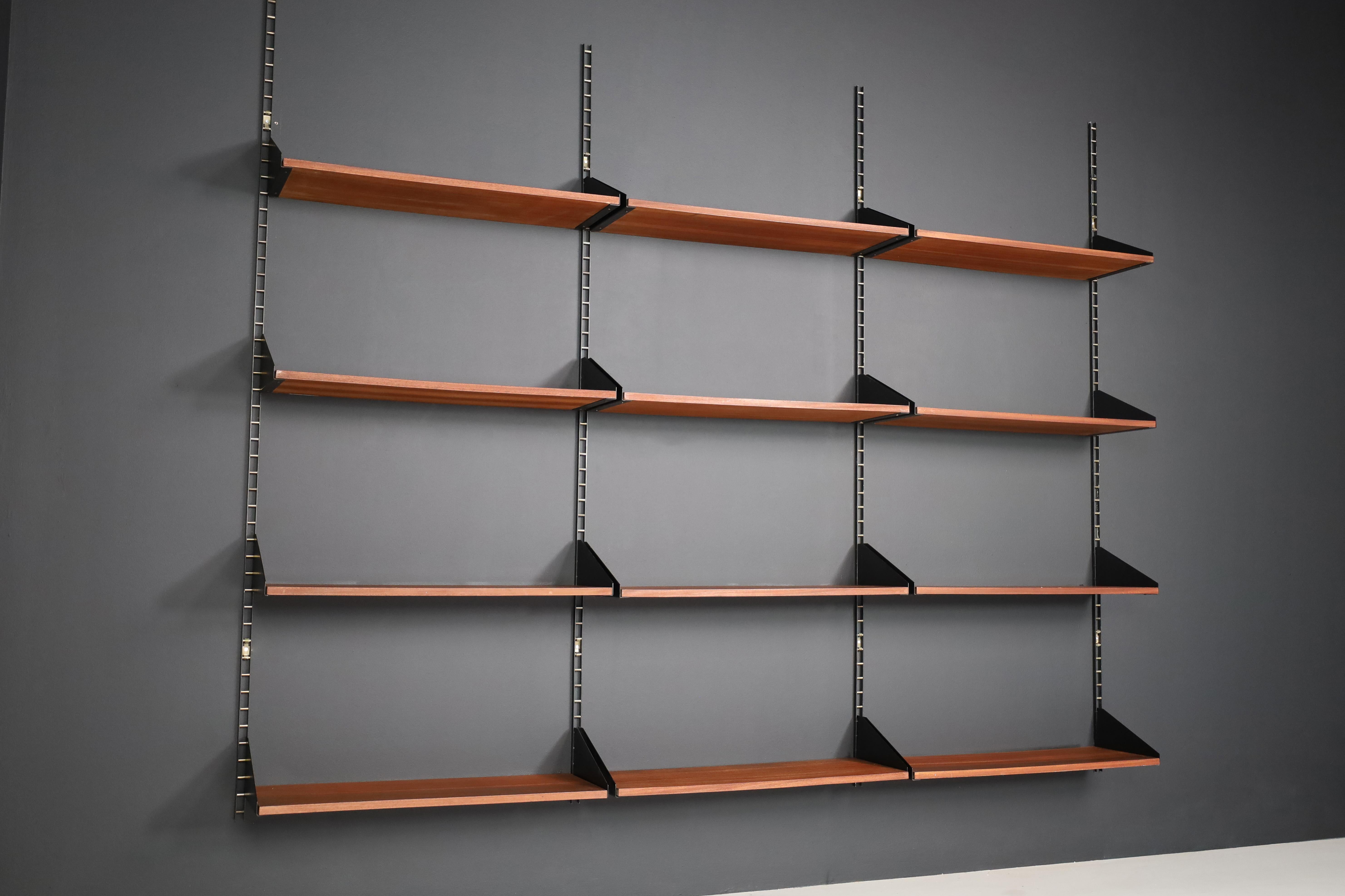 George Nelson Steel and Brass Wall Unit / Book Shelf USA 1960s

This is a George Nelson wall unit made of steel, Brass, and teak, designed in the 1960s in the United States. The shelves can be flexibly installed and are in excellent condition with