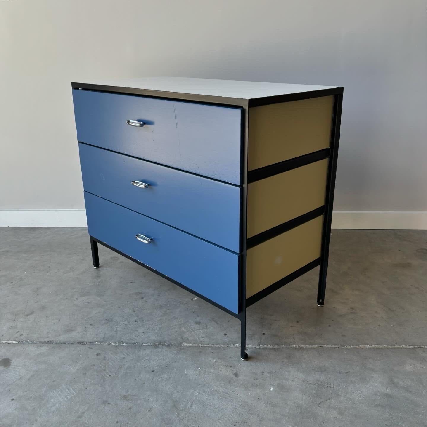 An all original George Nelson small dresser.  In good vintage condition with sign of age and use.   Minor chipping of painted drawer fronts, loss of paint, oxidation to frame.  Herman Miller production dating to the 1950s.
