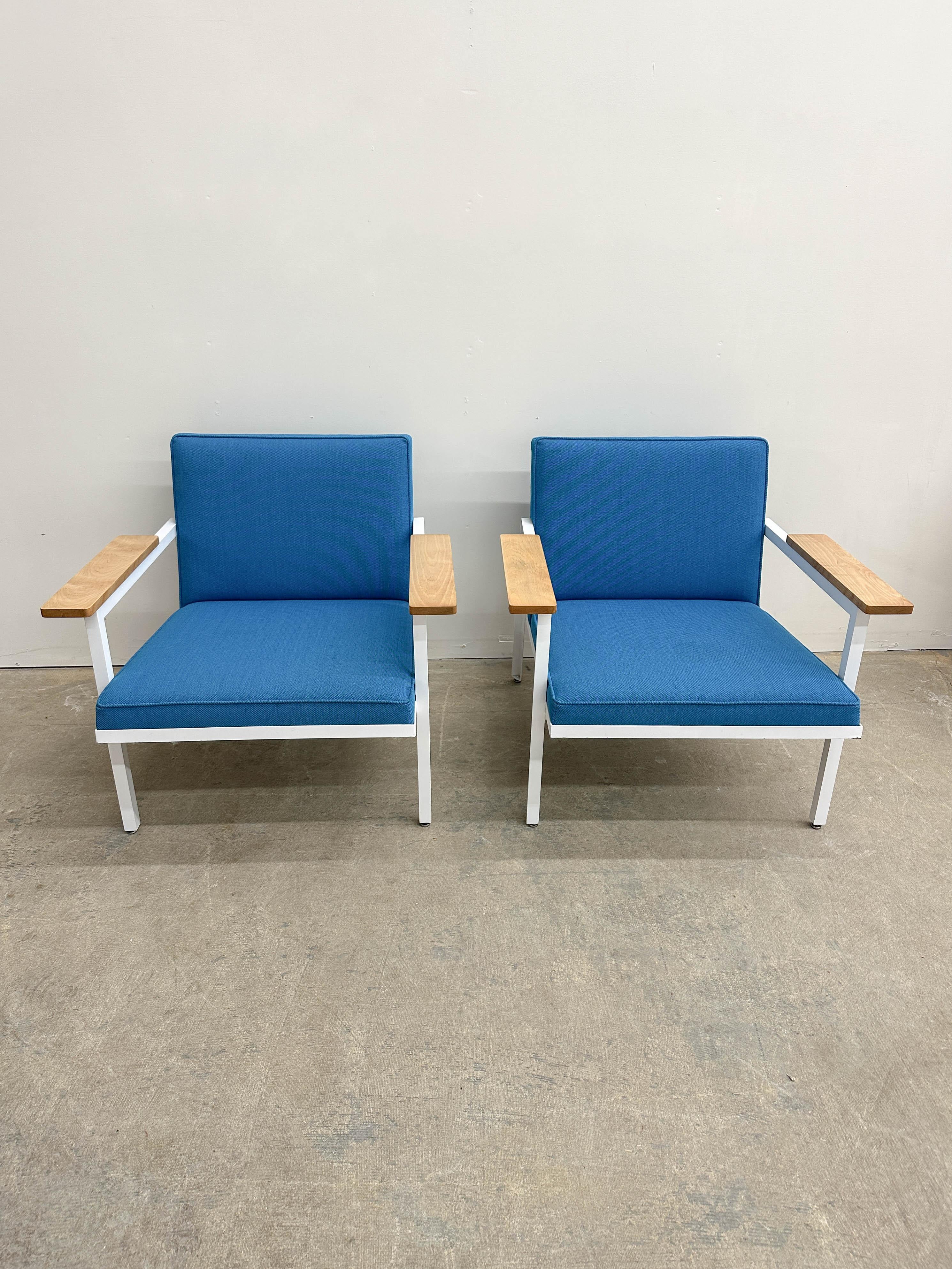 Classic minimalist George Nelson armchair design 5080 from 1950 for Herman Miller. Featuring a stripped down, angular steel frame, oversized natural finish birch plank armrests and simple-lined cushions, this chair is the epitome of Nelson's