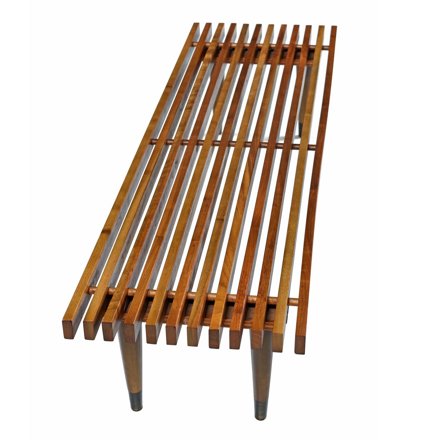 Without any markings or typical signs of production furniture of the 1950s, we think this may be a home made creation. The Mid-Century Modern slat bench is perhaps one of the most recognizable and beloved pieces of furniture from the period. Every