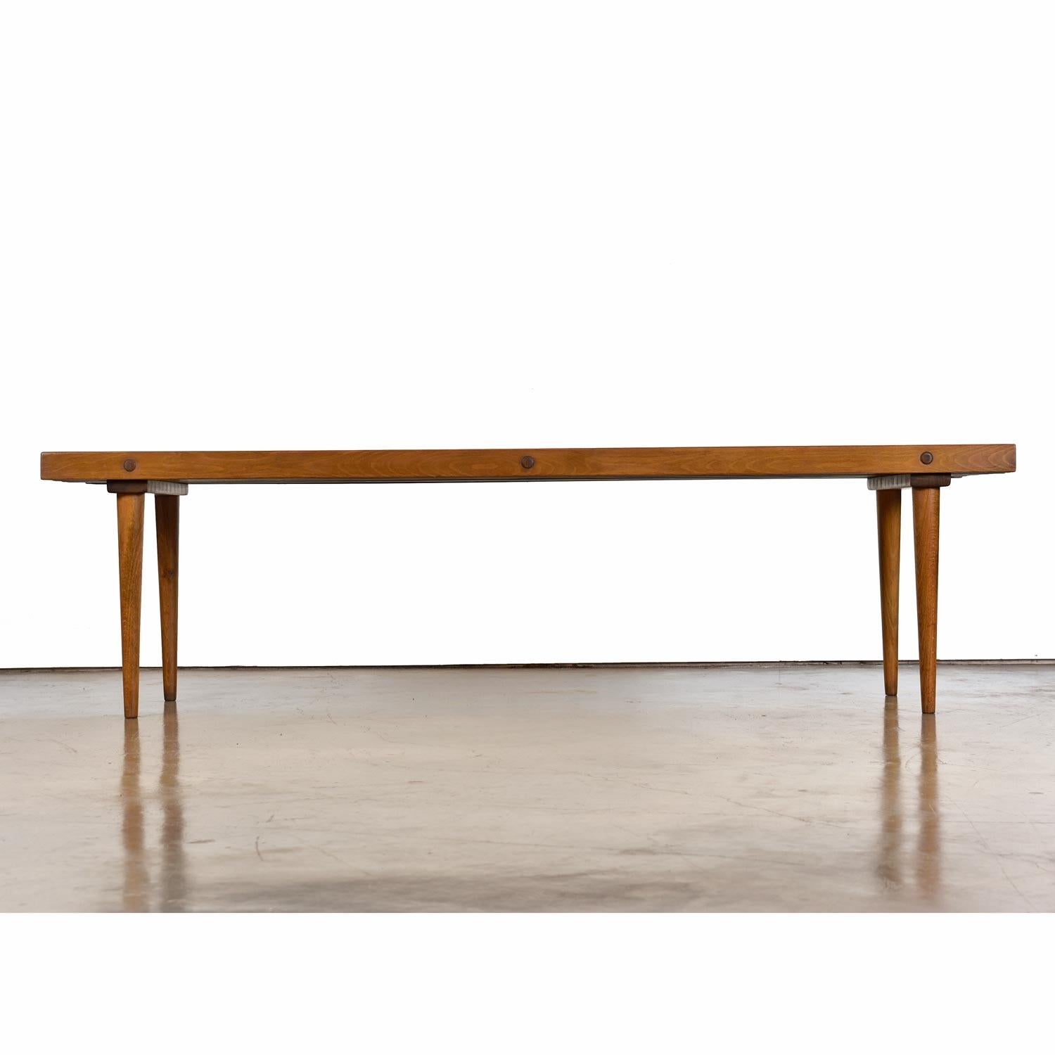 The Mid-Century Modern slat bench is perhaps one of the most recognizable and beloved pieces of furniture from the period. Every home needs at least one. It's practicality is only matched by its charmed. Use this solid beech wood piece as a bench,