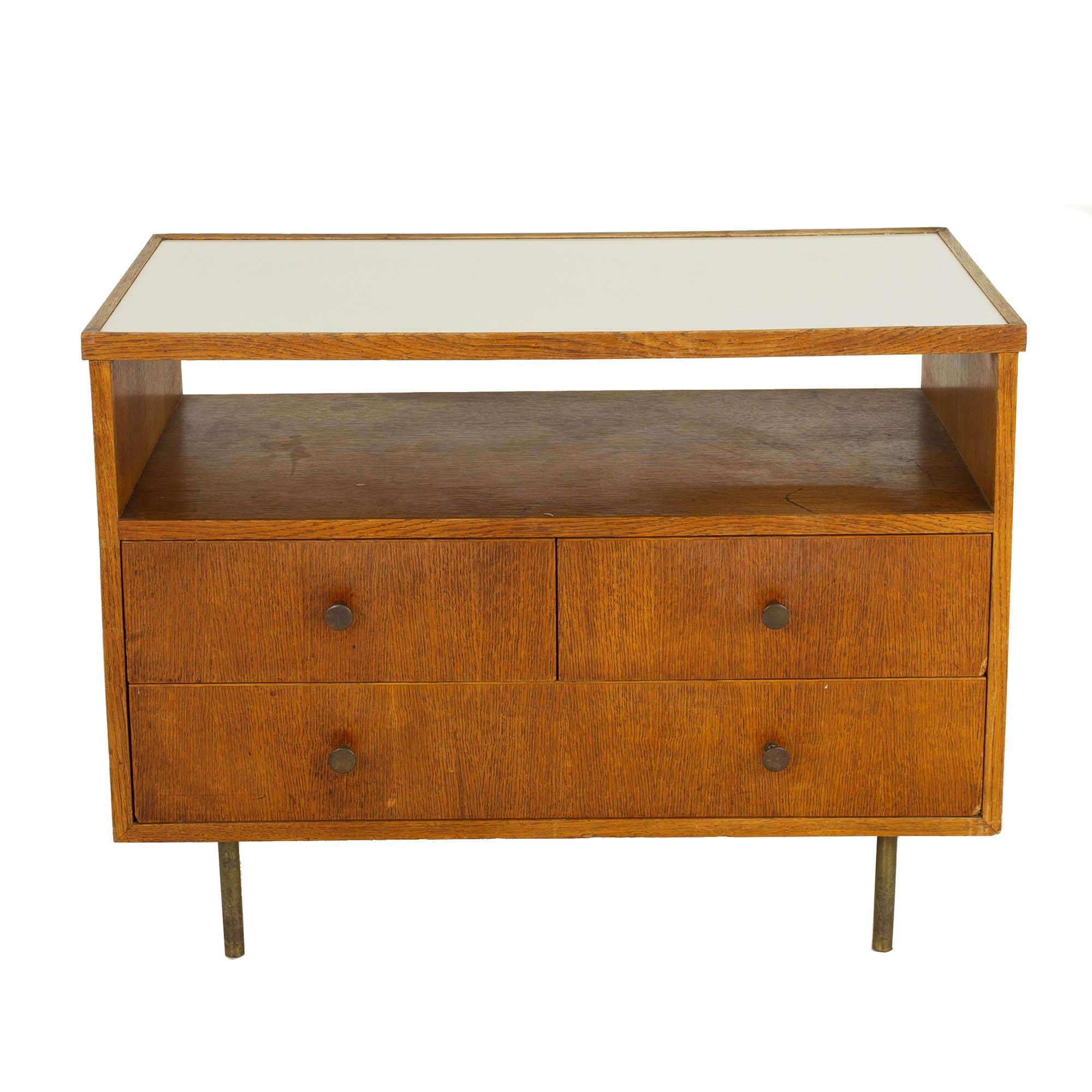 George Nelson style mid century oak bar media cabinet

This cabinet measures: 34.5 wide x 18.5 deep x 26 inches high

?All pieces of furniture can be had in what we call restored vintage condition. That means the piece is restored upon purchase