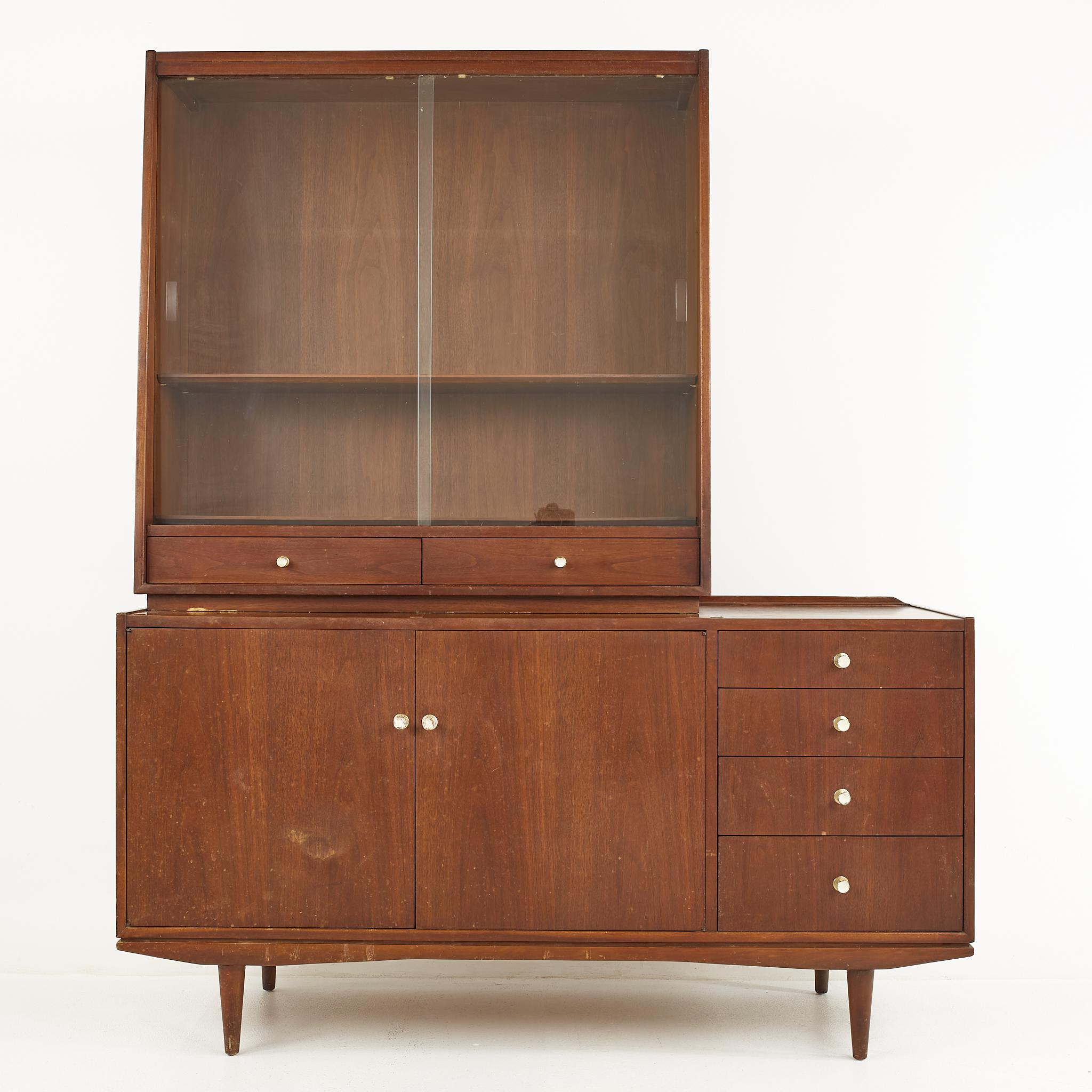 George Nelson style morganton mid century walnut buffet and hutch

This set measures: 60 wide x 20 deep x 73.25 inches high
The buffet measures: 60 wide x 20 deep x 31.25 inches high
The hutch measures: 42 wide x 15 deep x 42 inches high

All