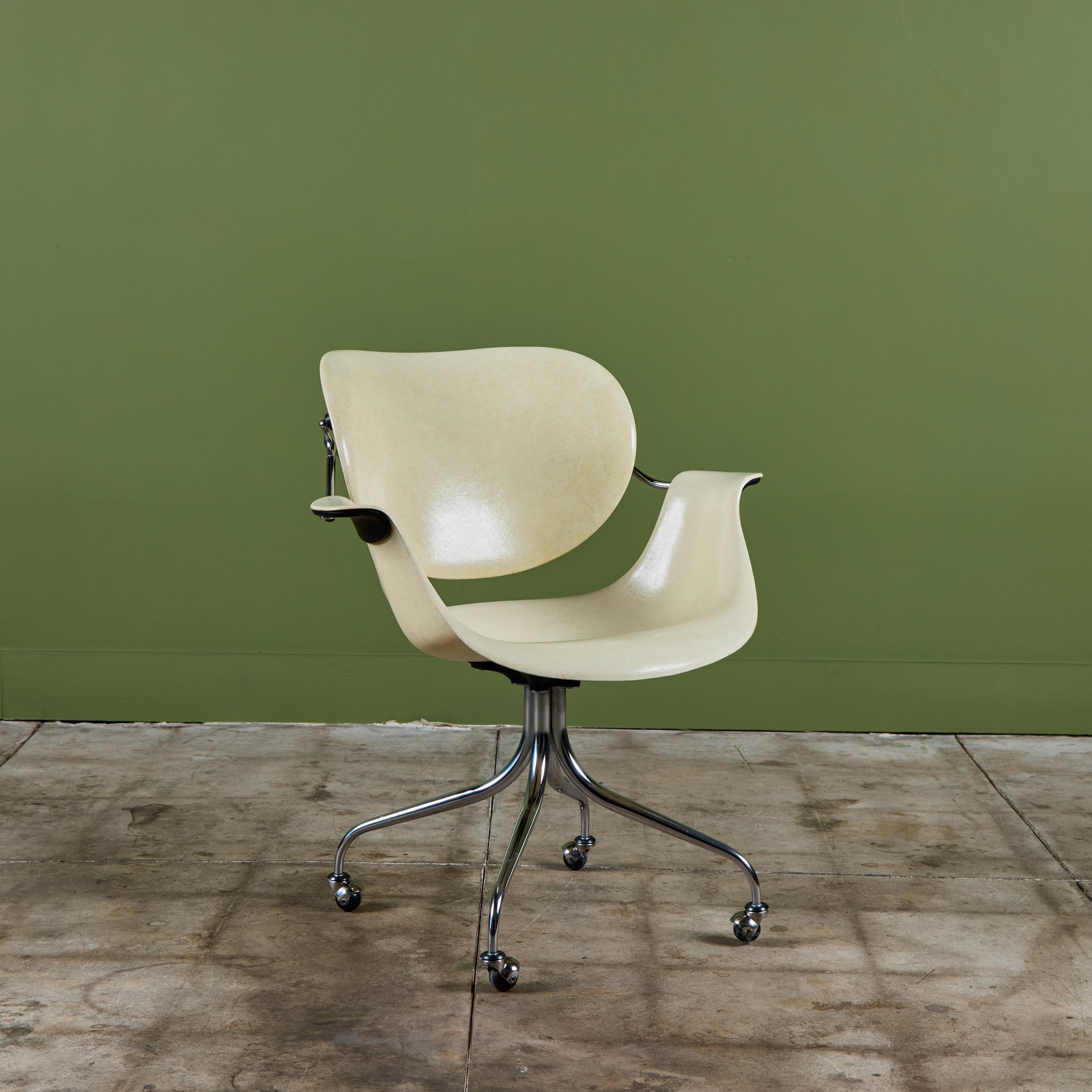 George Nelson lounge chair for Herman Miller, c.1950's, USA. The design features a beige molded plastic chair form. The chair is part of a larger collection called the “Swaged Leg Group.” Nelson used both Eames’s shock-mounted connectors and