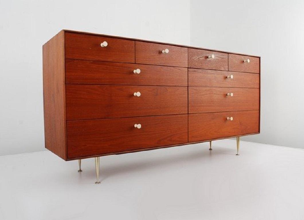 George Nelson thin edge cabinet for Herman Miller. Can also be used as a dresser or credenza. Item is walnut, with original finish and original handles.
