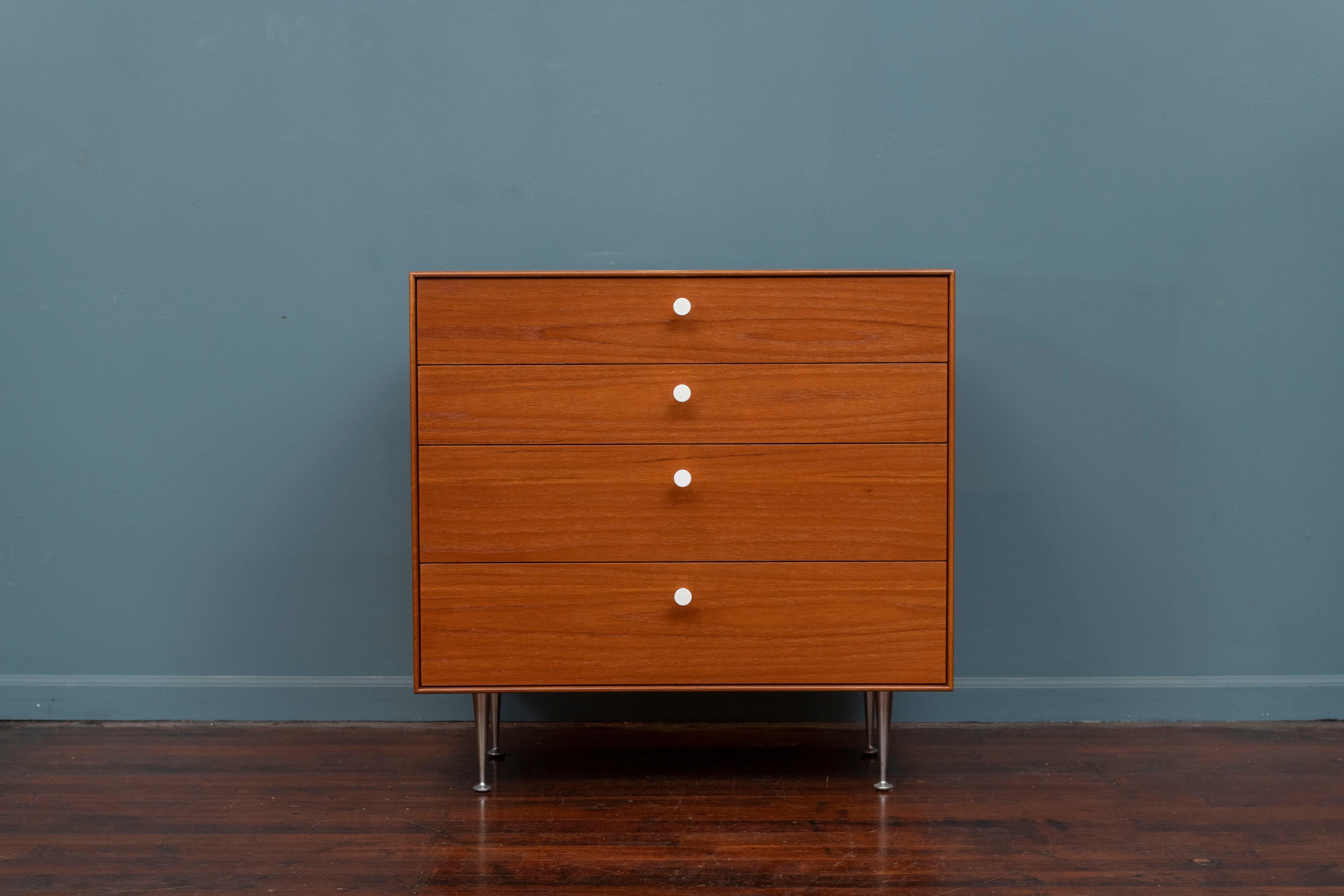 George Nelson Thin Edge teak dresser for Herman Miller. Newly refinished with porcelain pulls and tapering cast aluminum legs. Four drawers with easy action and dividers to help keep things organized, labeled.