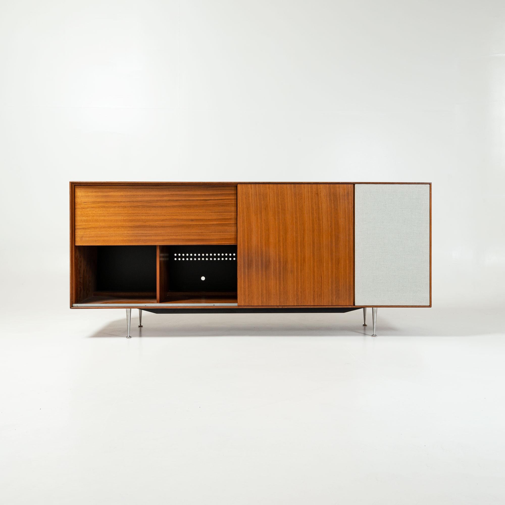 Rare and iconic George Nelson famous Thin Edge Line Hi Fi cabinet in Walnut, produced by Herman Miller in 1950s.

The Cabinet has a total of 6 cabinet space, with the far right designed for a built in speaker. The middle space has adjustable