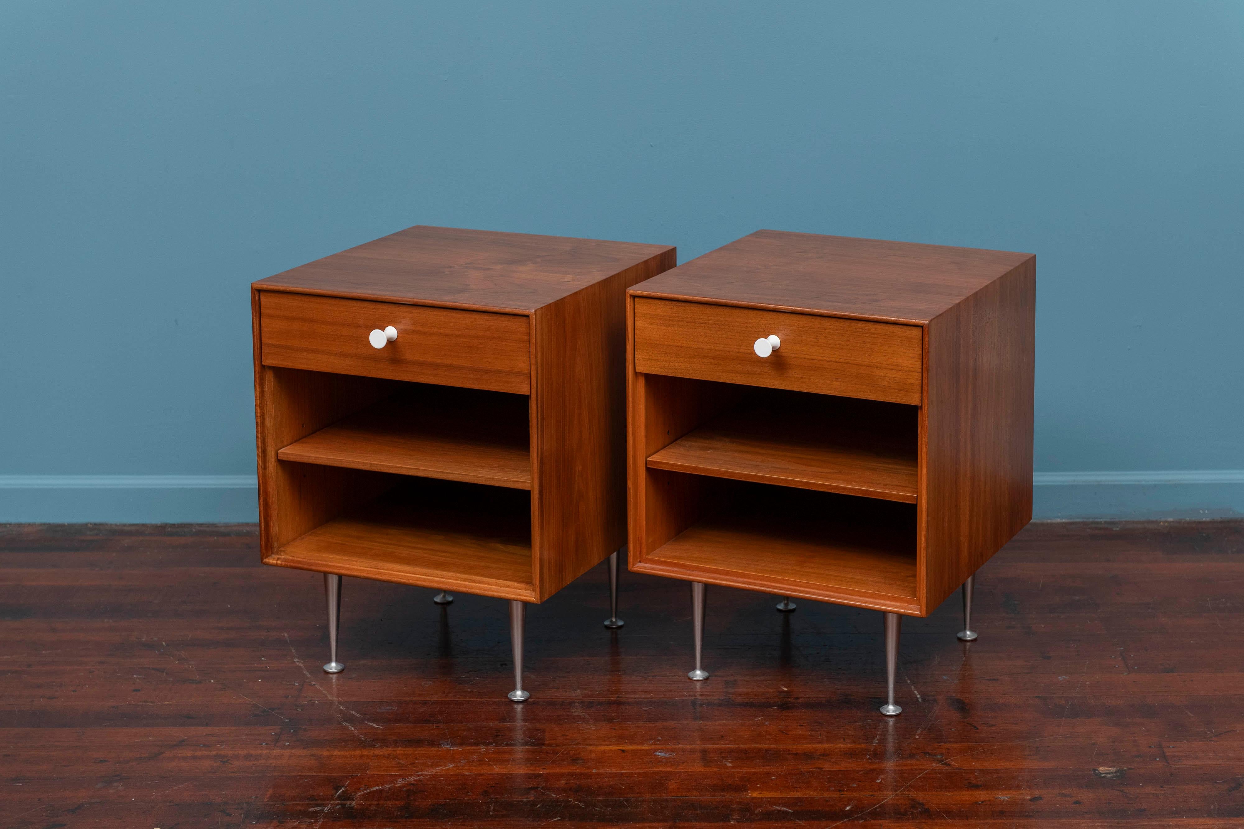 George Nelson Thin Edge nightstands for Herman Miller. Iconic design for Nelson's Thin Edge series produced by Herman Miller, Michigan U.S.A. Matched pair of figured walnut nightstands featuring one top drawer and an adjustable shelf on tapering