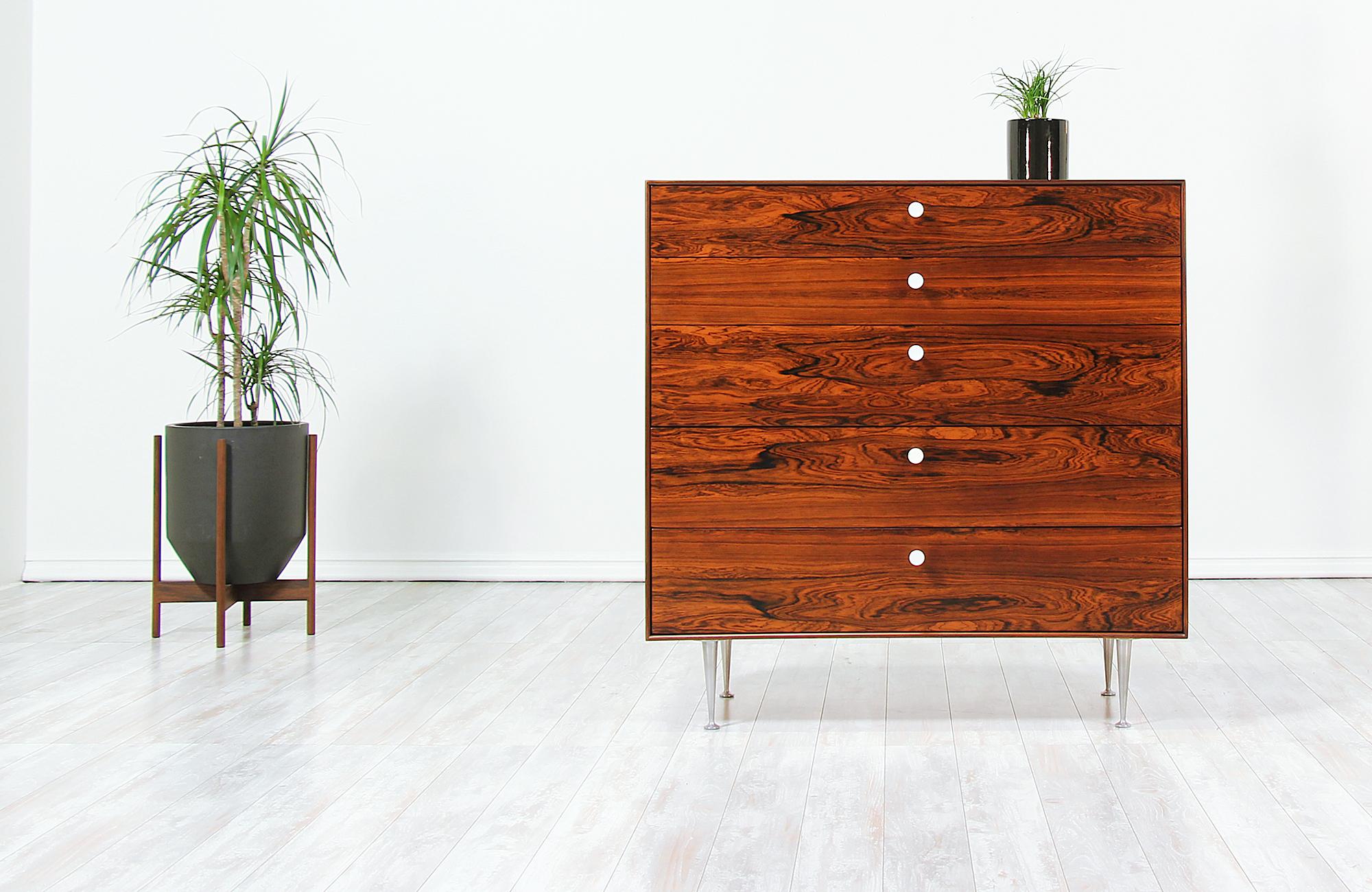 Stunning chest of drawers designed by George Nelson for Herman Miller in the United States, circa 1950s. Just like the rest of his 'Thin Edge' collection for Herman Miller, this beautiful rosewood chest features a solid frame with five drawers and