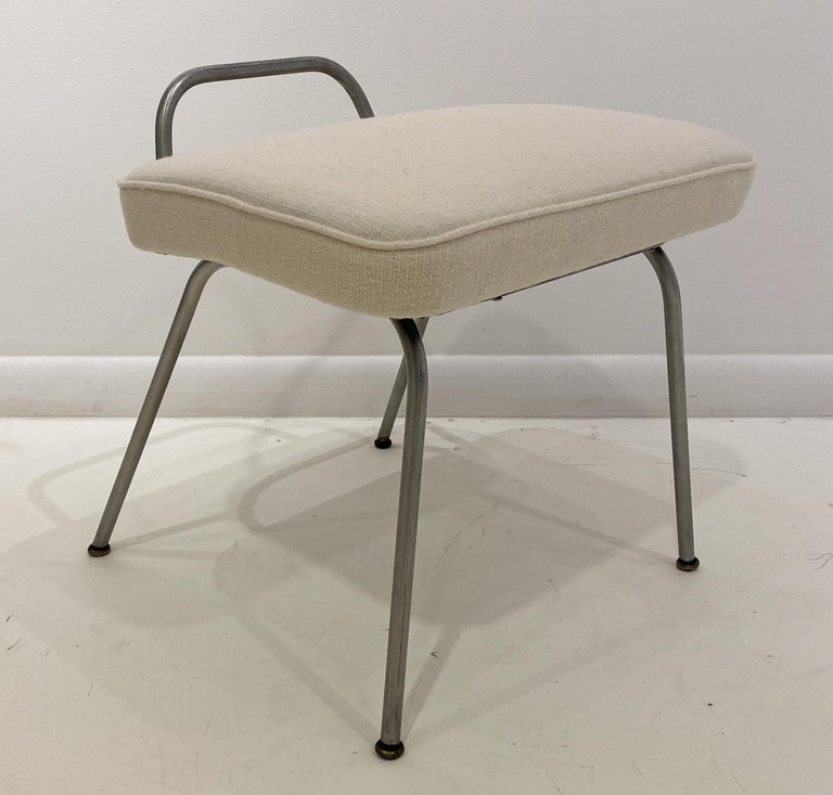 Vanity stool with a bent aluminum frame and fabric seat designed by George Nelson & Associates in 1948 and produced by Herman Miller circa 1950's. A scarce item in the Herman Miller canon. The frame is in original condition, with its original