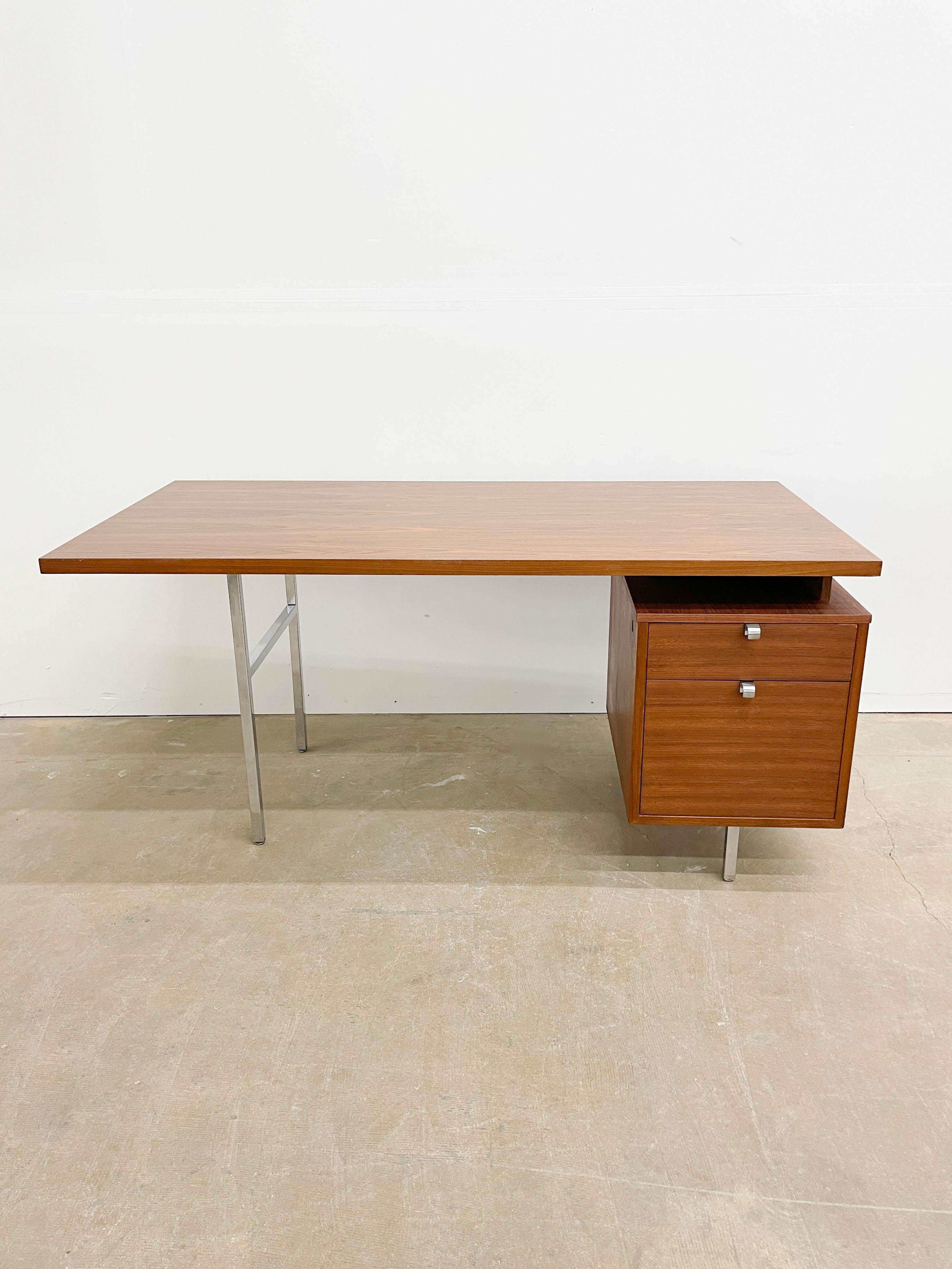 This is a beautiful 1950s desk designed by George Nelson for Herman Miller. As part of the Executive Office Group collection, the desk is an iconic part of mid-century modern design history. Crafted out of walnut, this desk boasts a floating top