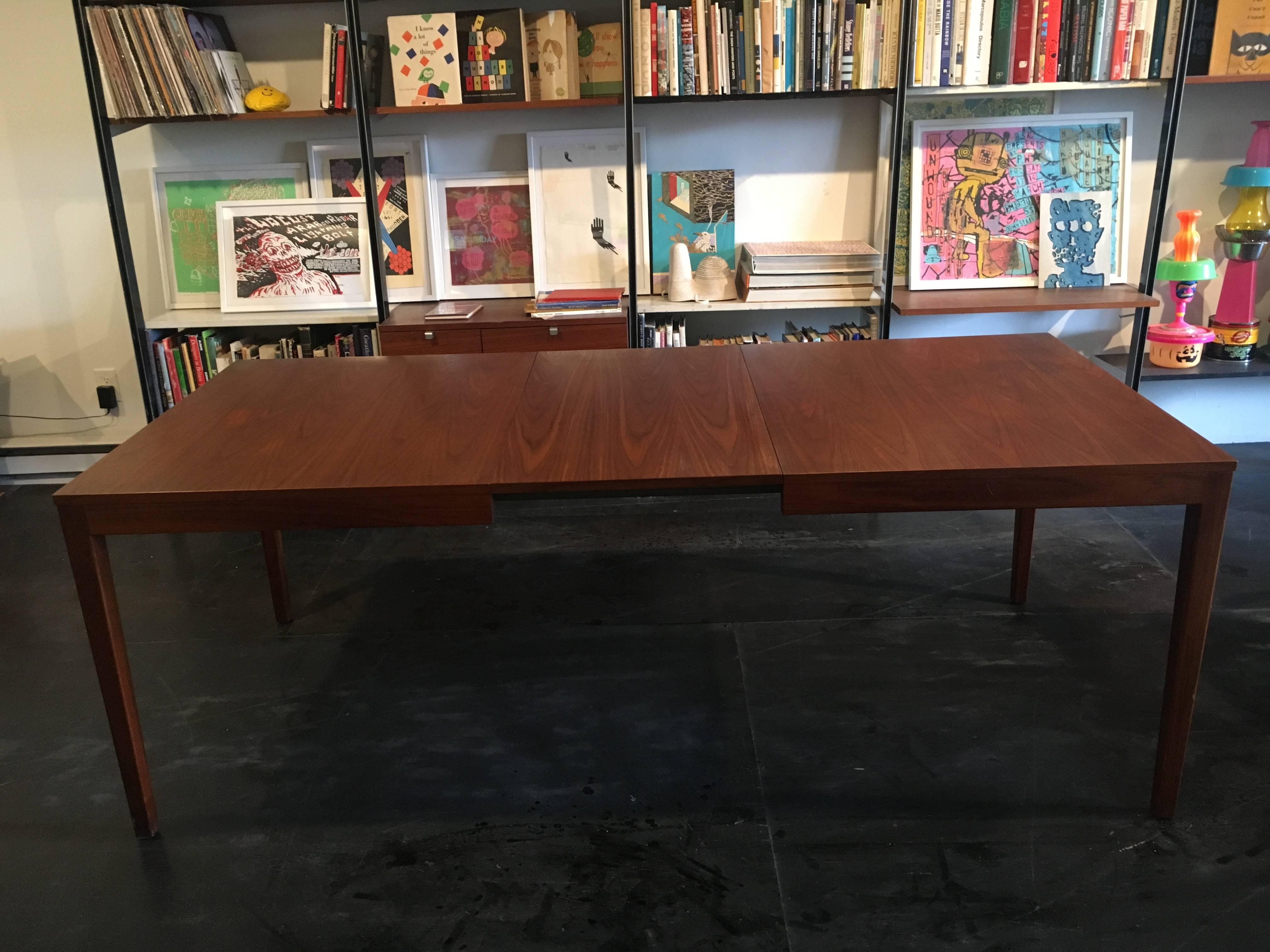 Walnut extension dining table designed by George Nelson for Herman Miller, 1950.

Seats 10-12, depending on chairs.

Measure: Full length including two leaves 100