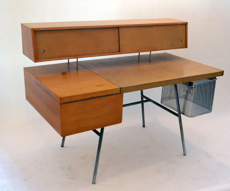 From George Nelson's ground breaking 1948 group of designs for Herman Miller that put the company firmly in the ranks of post war modernism. Nelson's desk was decidedly futuristic, with the floating cabinet above the desktop, containing numerous