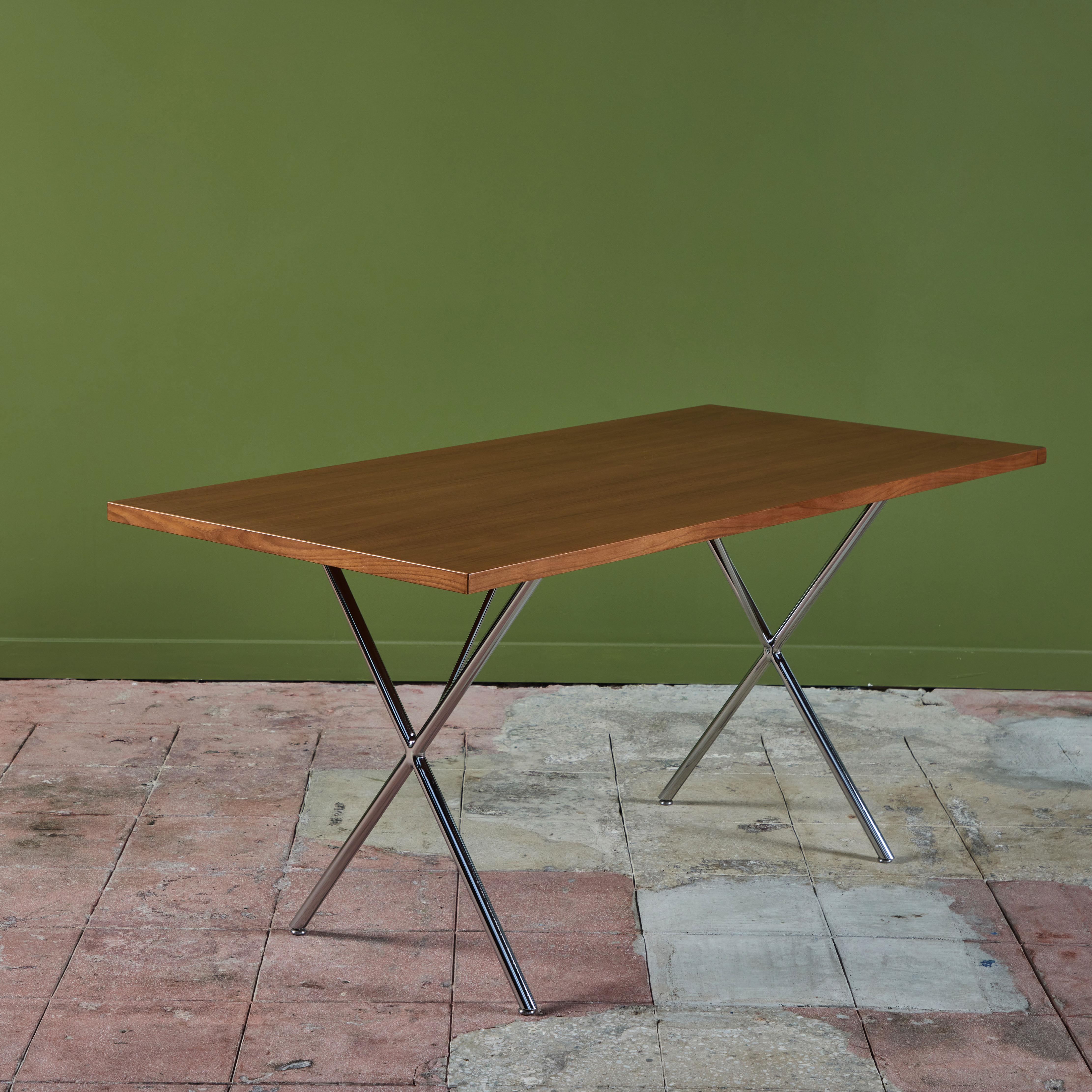 George Nelson X-Leg Table for Herman Miller. Originally designed and produced in the 1950s this was made as a work table for an office but equally intended for a dining space as well. The table features a walnut table top and chrome legs that cross