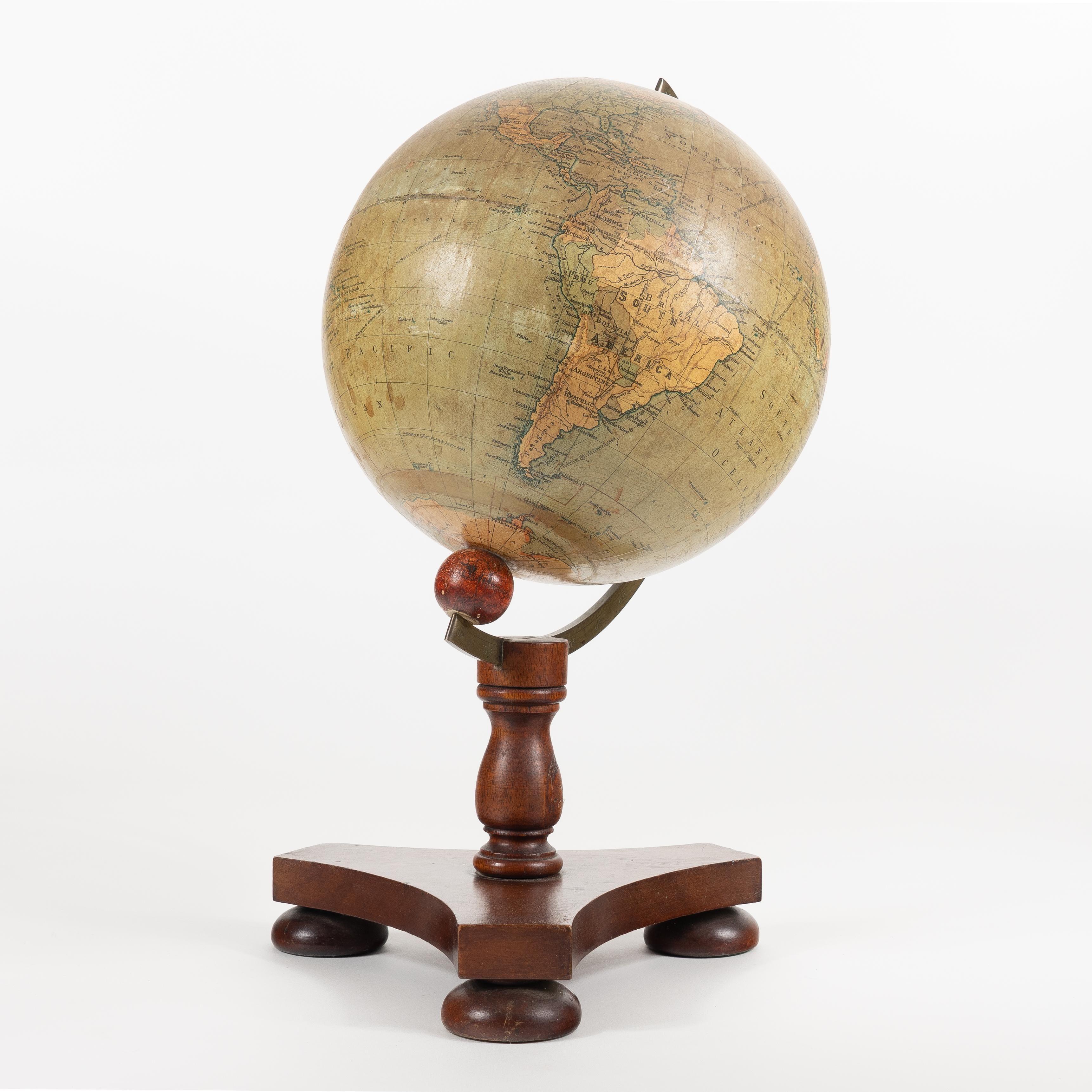 Terrestrial globe on original brass and mahogany stand by the English firm of George Philip and Son.
London, England, circa 1928.