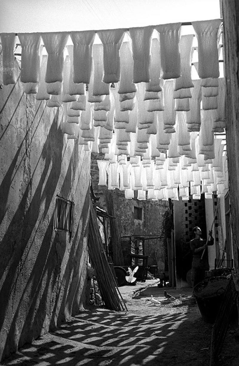 Skeins of cotton hanging to dry in dyers souk, Tunis, Tunisia, 1958.

All available sizes and editions:
16" x 20", Edition size 25
30"x 40", Edition size 25
40" x 60", Edition size 25

This photograph will be printed once payment has been received