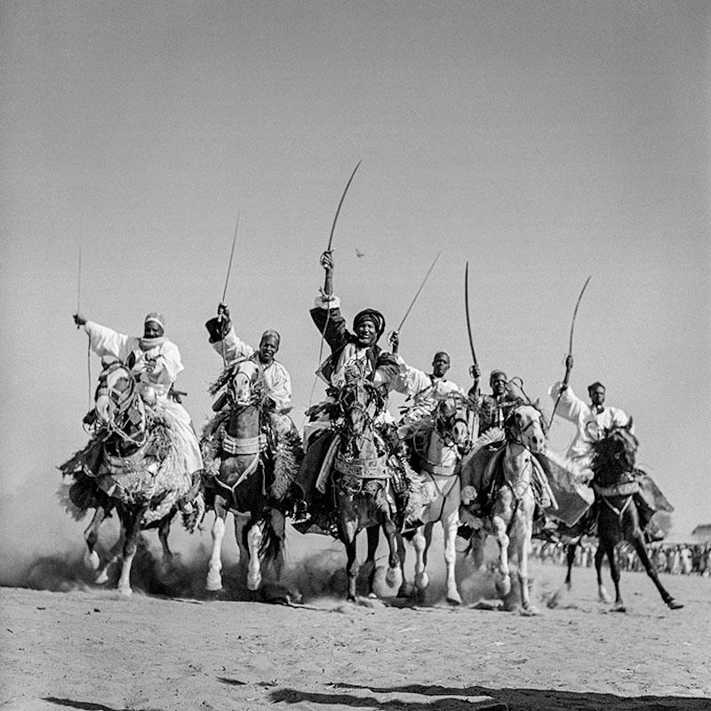 Soldiers from the Arab Legion desert patrol on their camels about 100 km from Amman, Transjordan, Fort Mafrak, 1941

All available sizes and editions:
16" x 20", Edition size 25
30"x 40", Edition size 25
40" x 60", Edition size 25

This photograph
