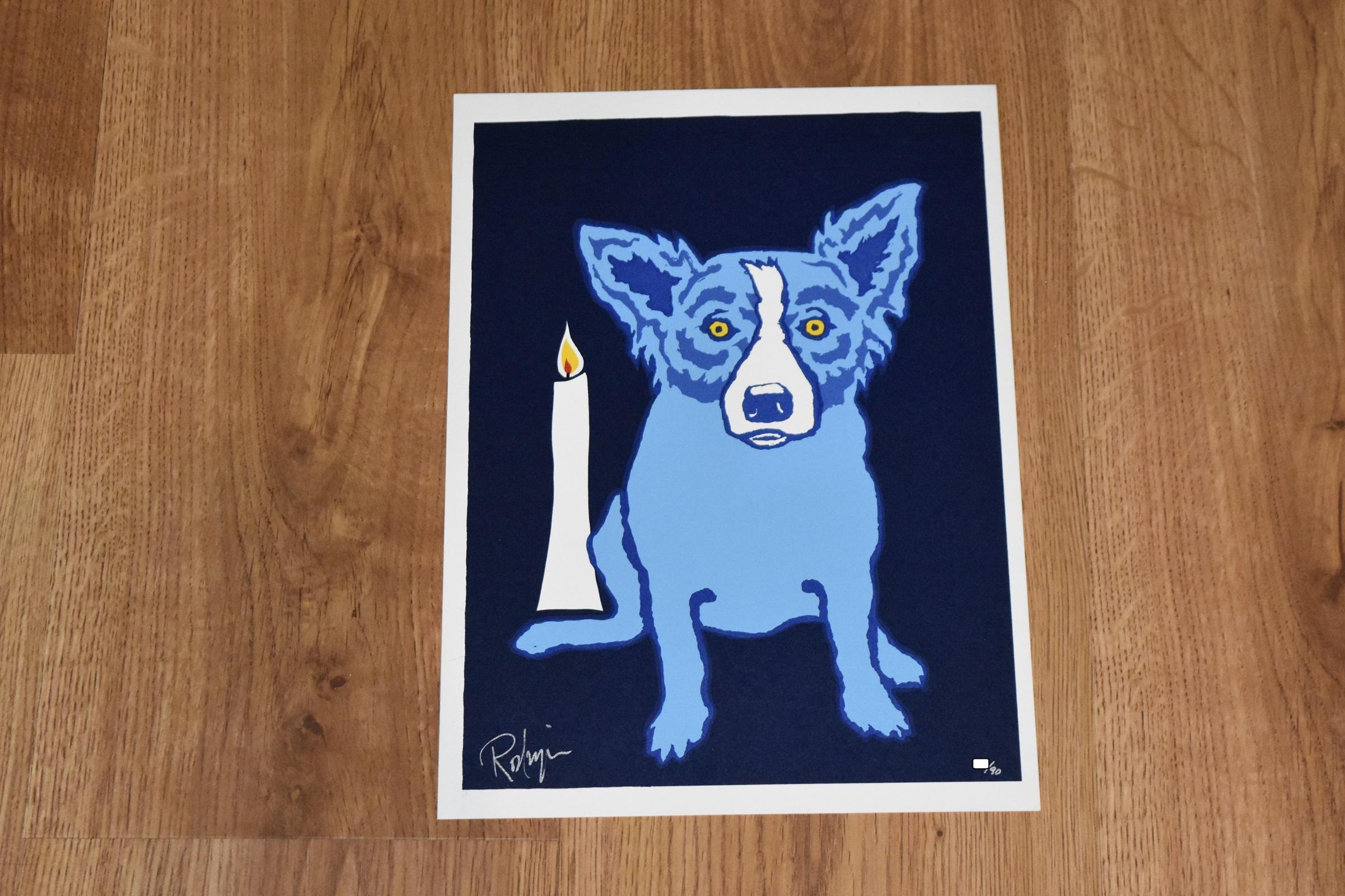 This Blue Dog work consists of one blue dog centered sitting on a black background with a single lit white candle to its side. The dog has soulful yellow eyes.  This pop art animal original silkscreen print on paper is hand signed by the