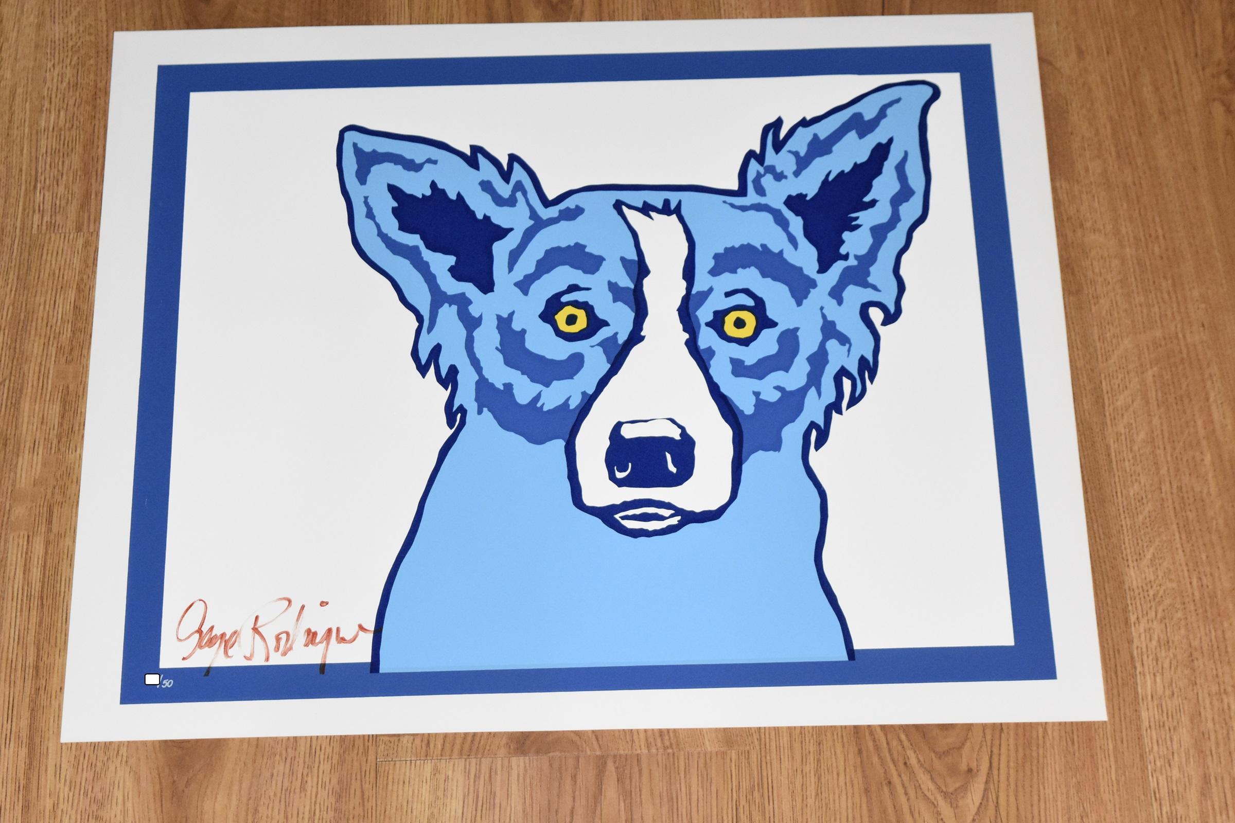 This Blue Dog work consists of one blue dog sitting on a white background with a blue frame line around the dog. The dog has soulful yellow eyes.  This pop art animal original silkscreen print on paper is hand signed by the artist.

Artist:  George