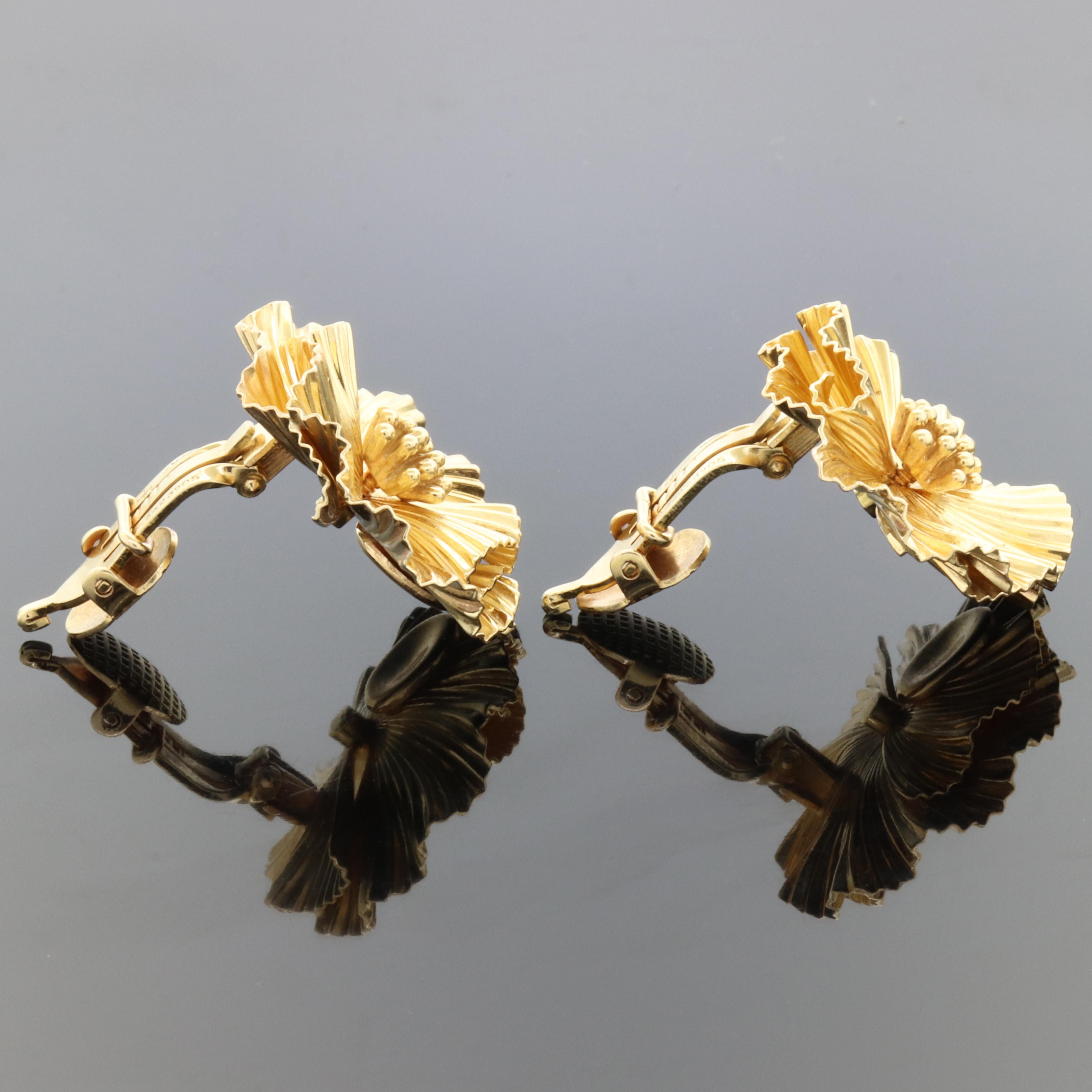 gold flower clip on earrings