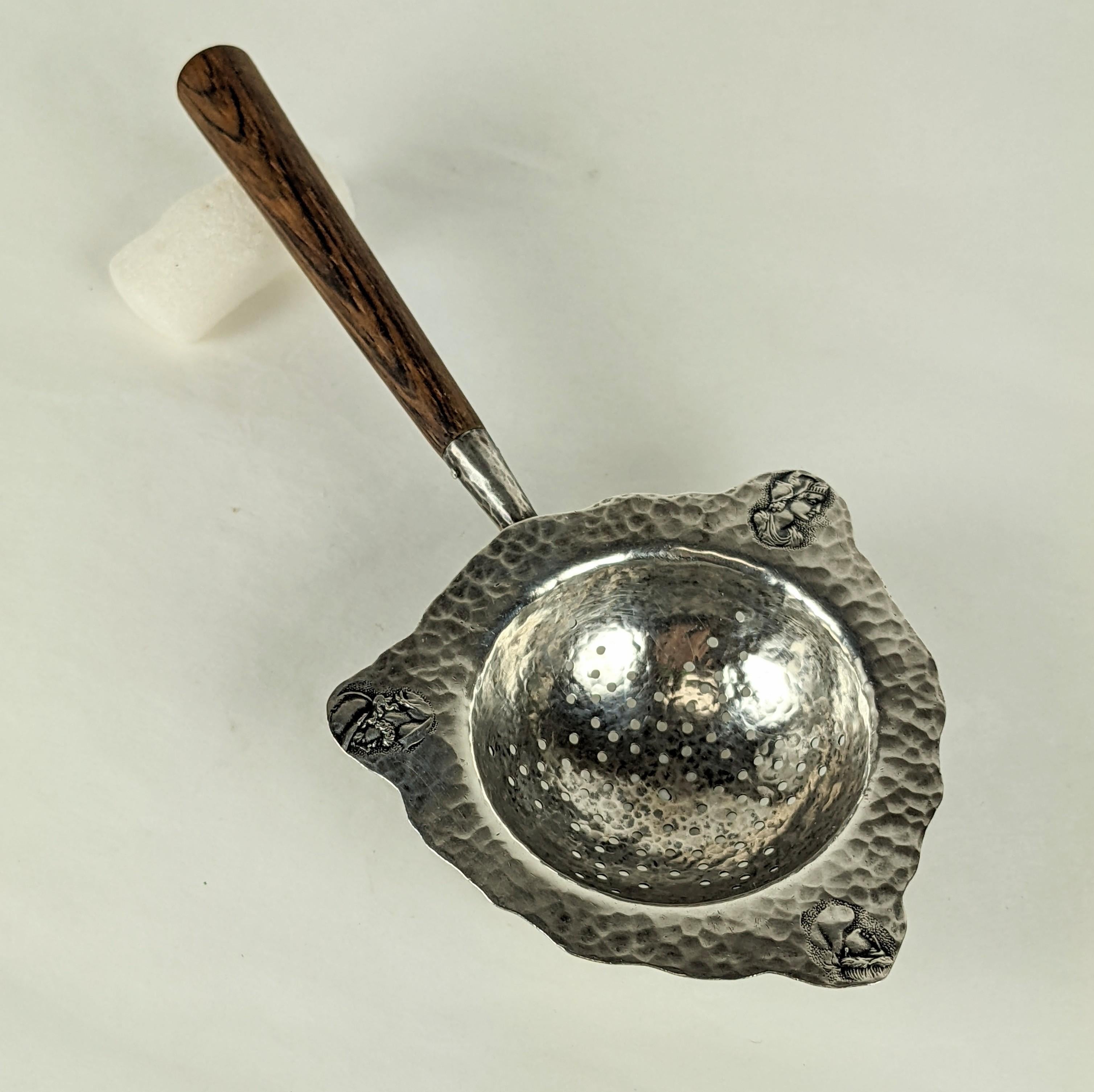 Aesthetic period George Shiebler sterling tea strainer from the late 19th Century. Homeric/ Medallion pattern hand raised with 3 mediallions of profiles from Antiquity. 1880's USA. Signed with company hallmark. Measures: 7.5