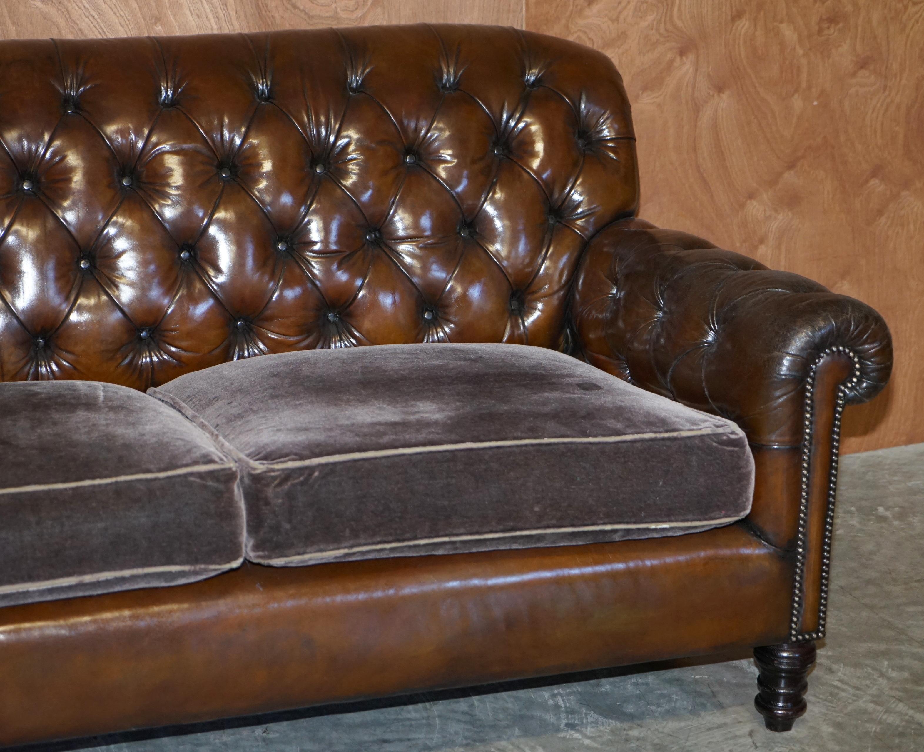 leather sofa with velvet cushions